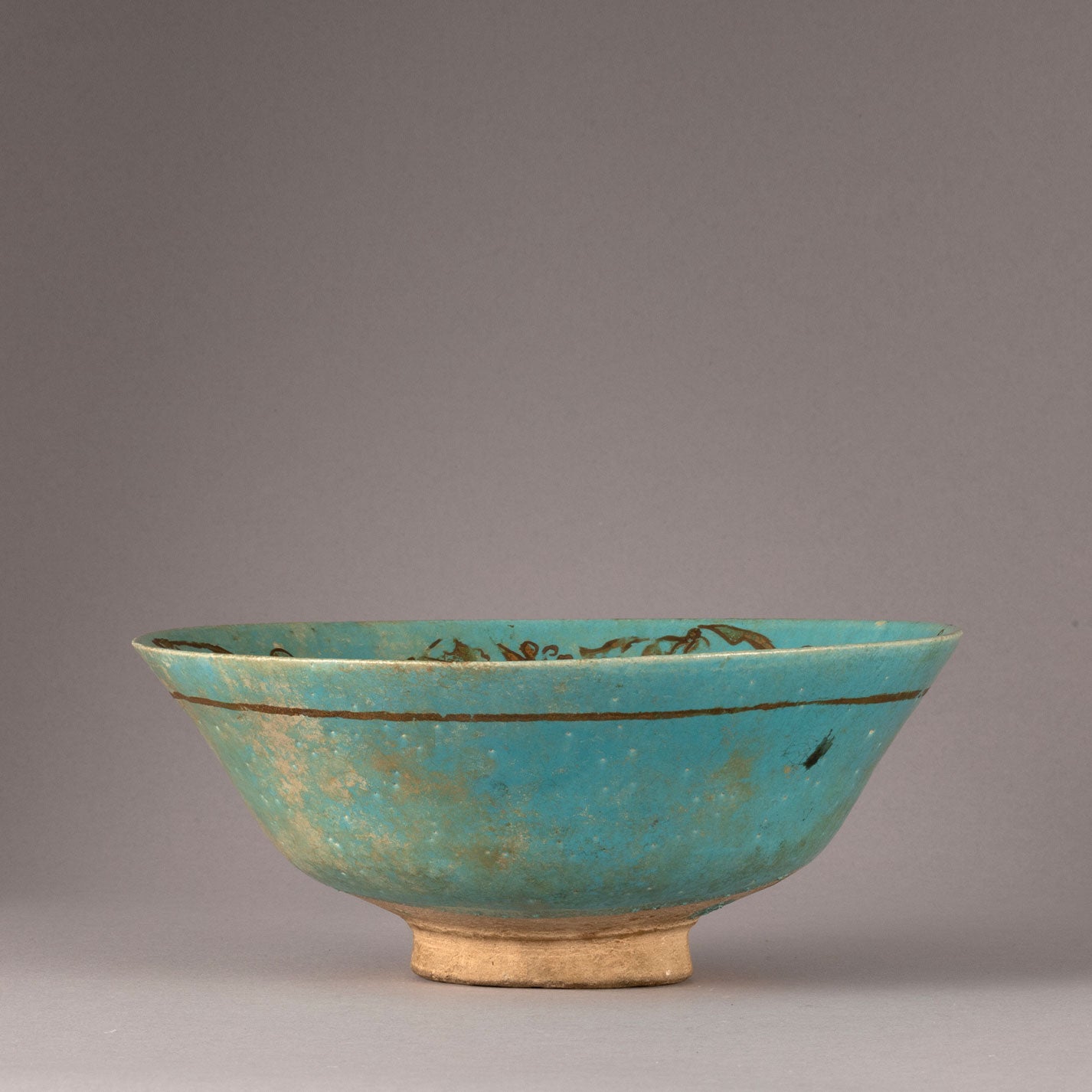 Kashan "Blue glazed with Gilt monster design bowl"