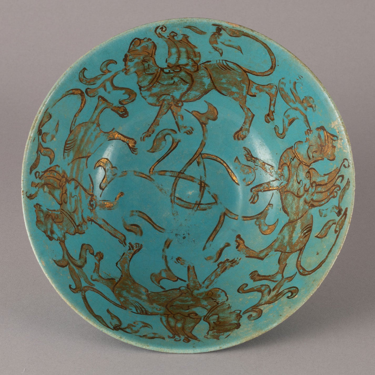 Kashan "Blue glazed with Gilt monster design bowl"