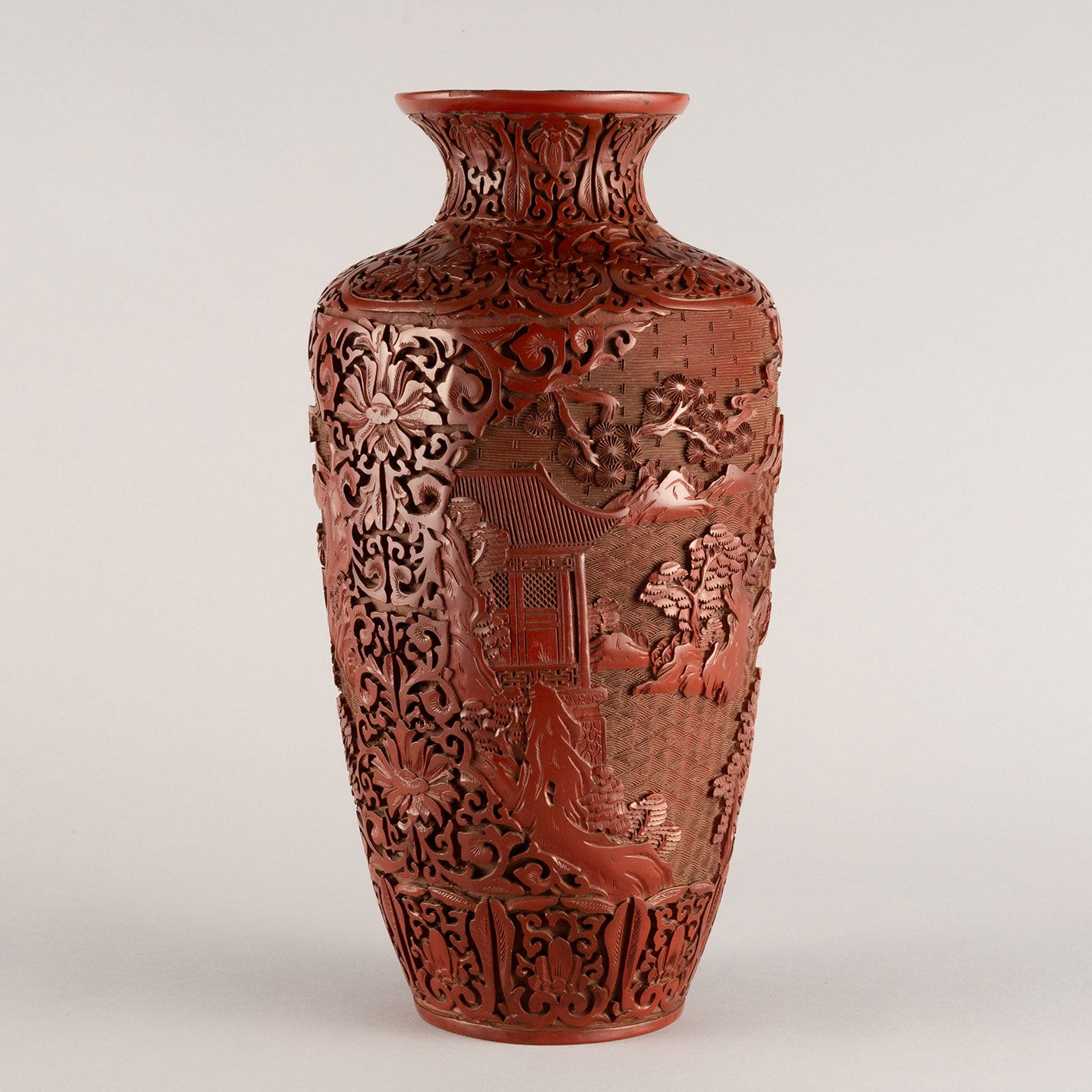 Vermilion-lacquered flower vase with landscape and tower design