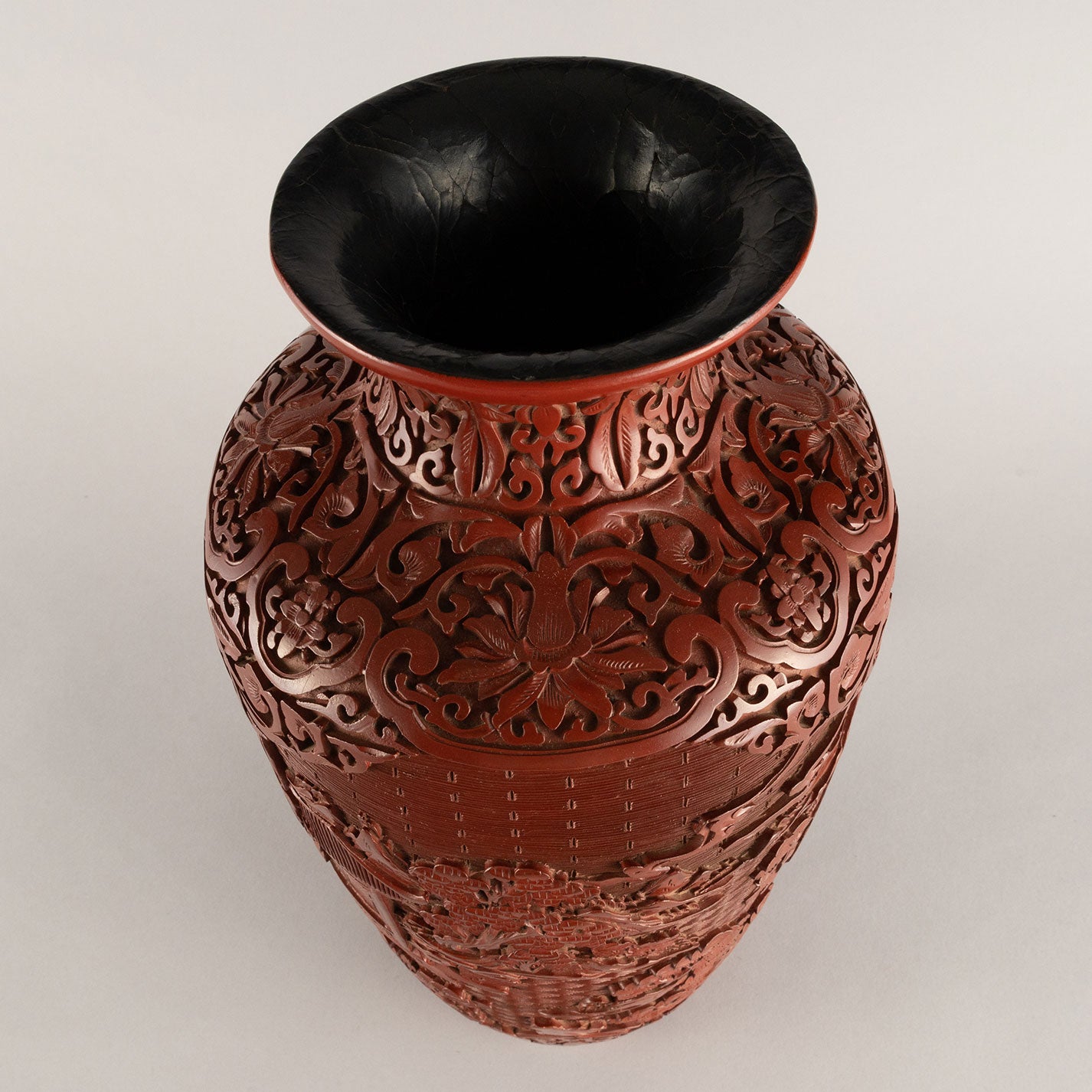 Vermilion-lacquered flower vase with landscape and tower design