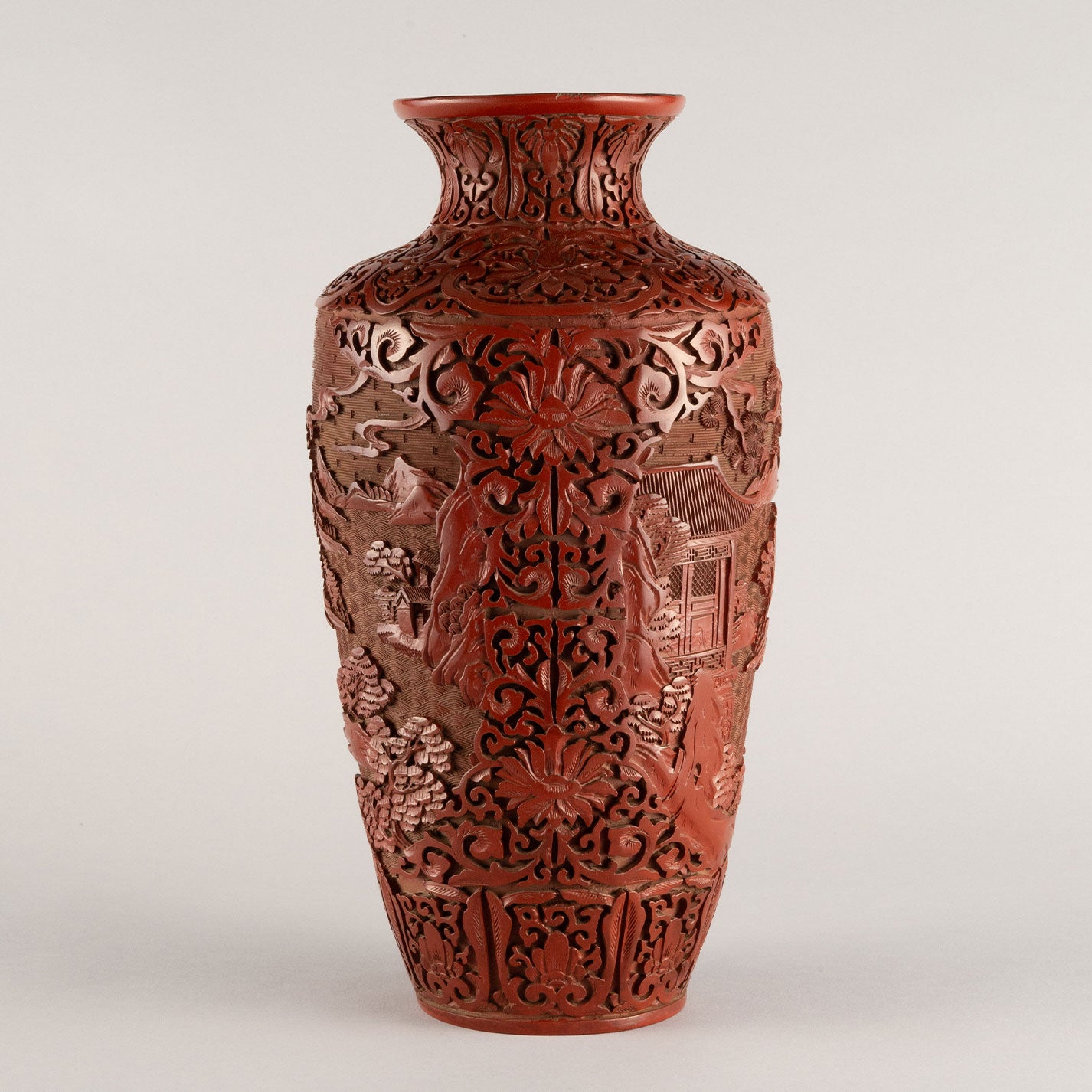 Vermilion-lacquered flower vase with landscape and tower design