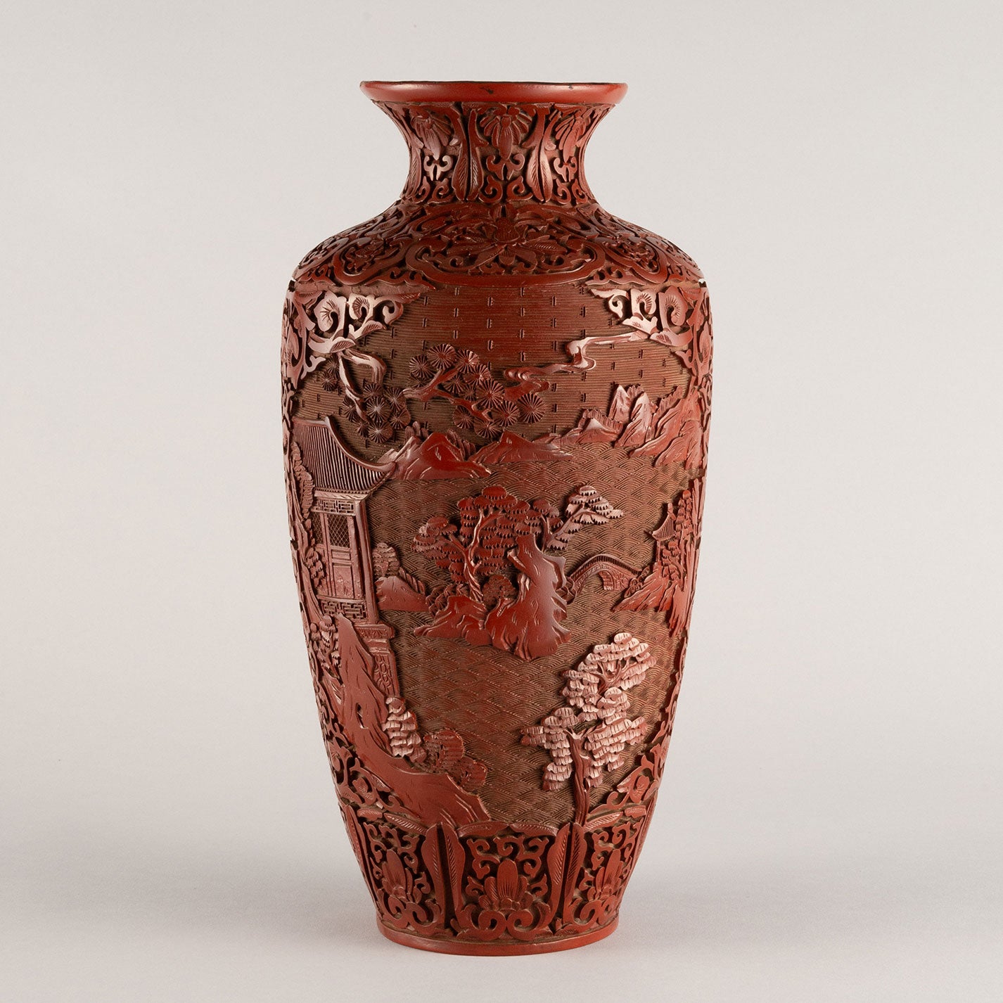 Vermilion-lacquered flower vase with landscape and tower design