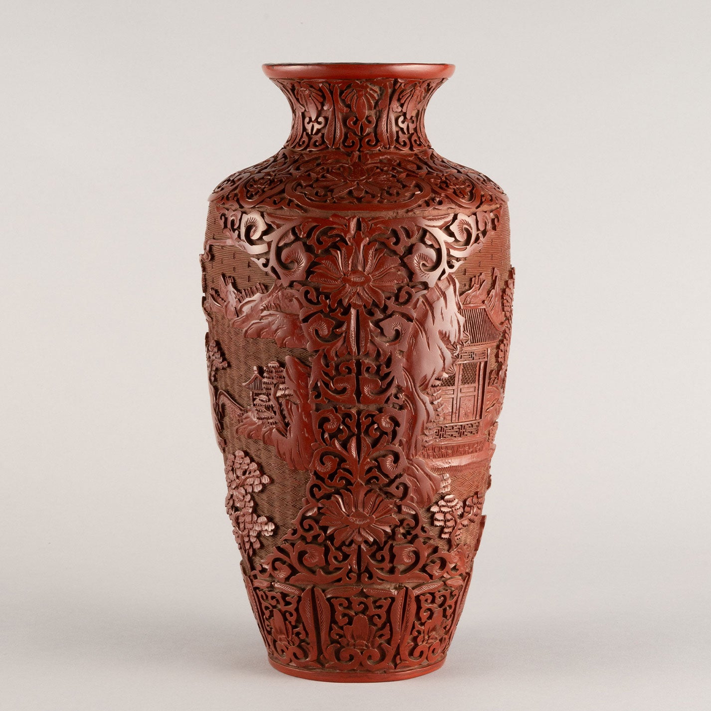 Vermilion-lacquered flower vase with landscape and tower design