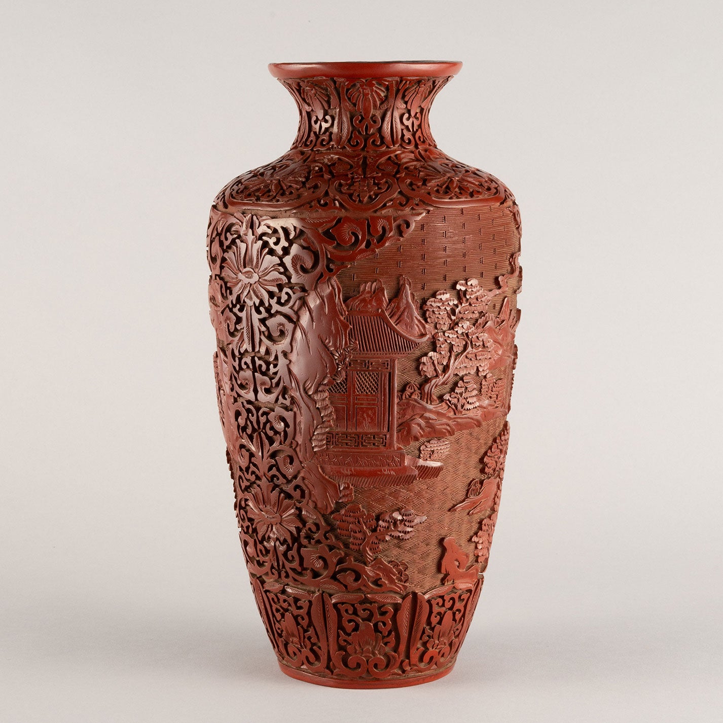 Vermilion-lacquered flower vase with landscape and tower design