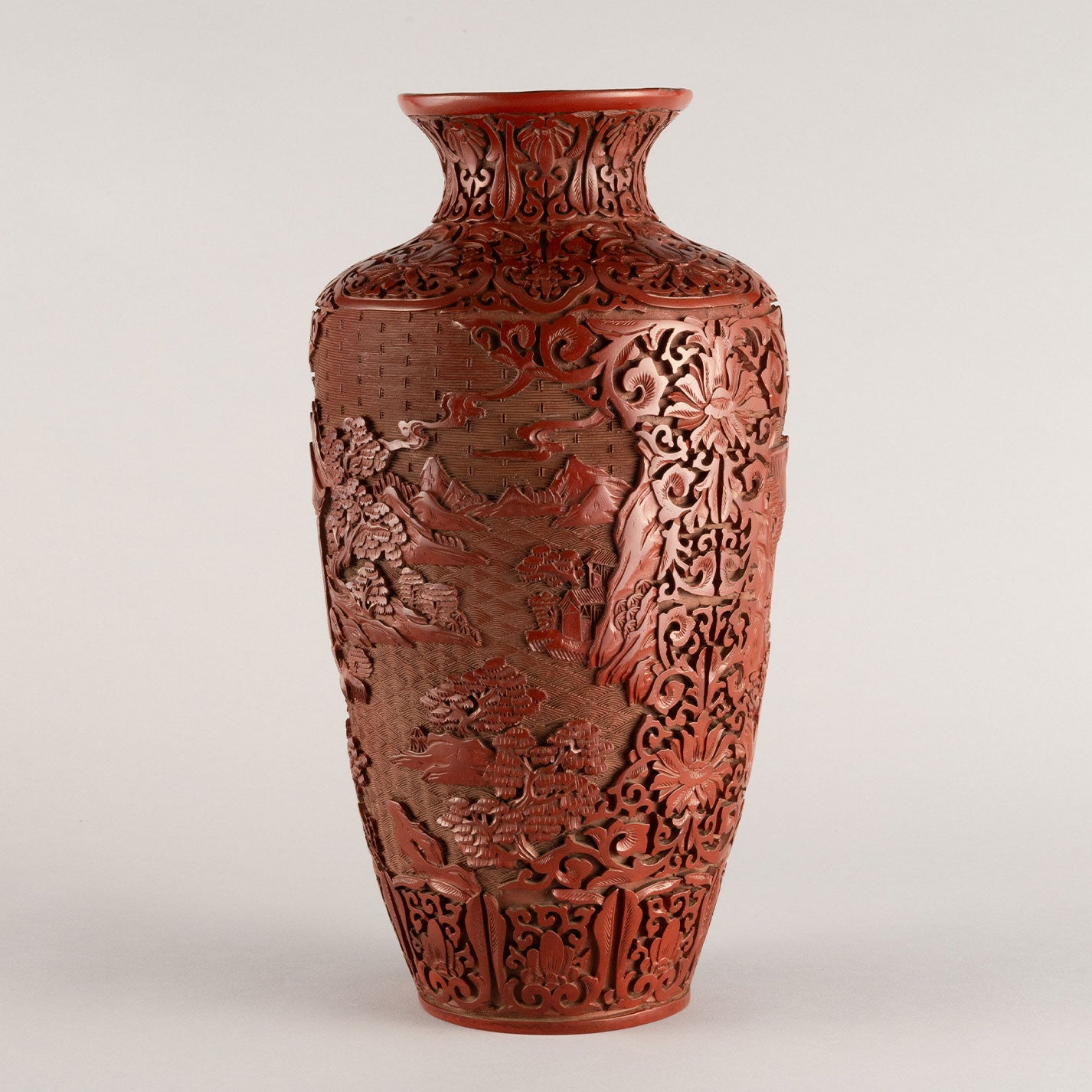 Vermilion-lacquered flower vase with landscape and tower design