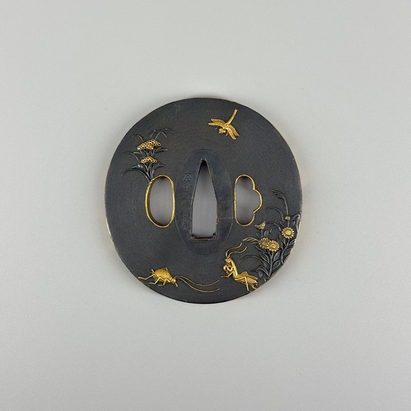 Bird and insect motif sword fittings