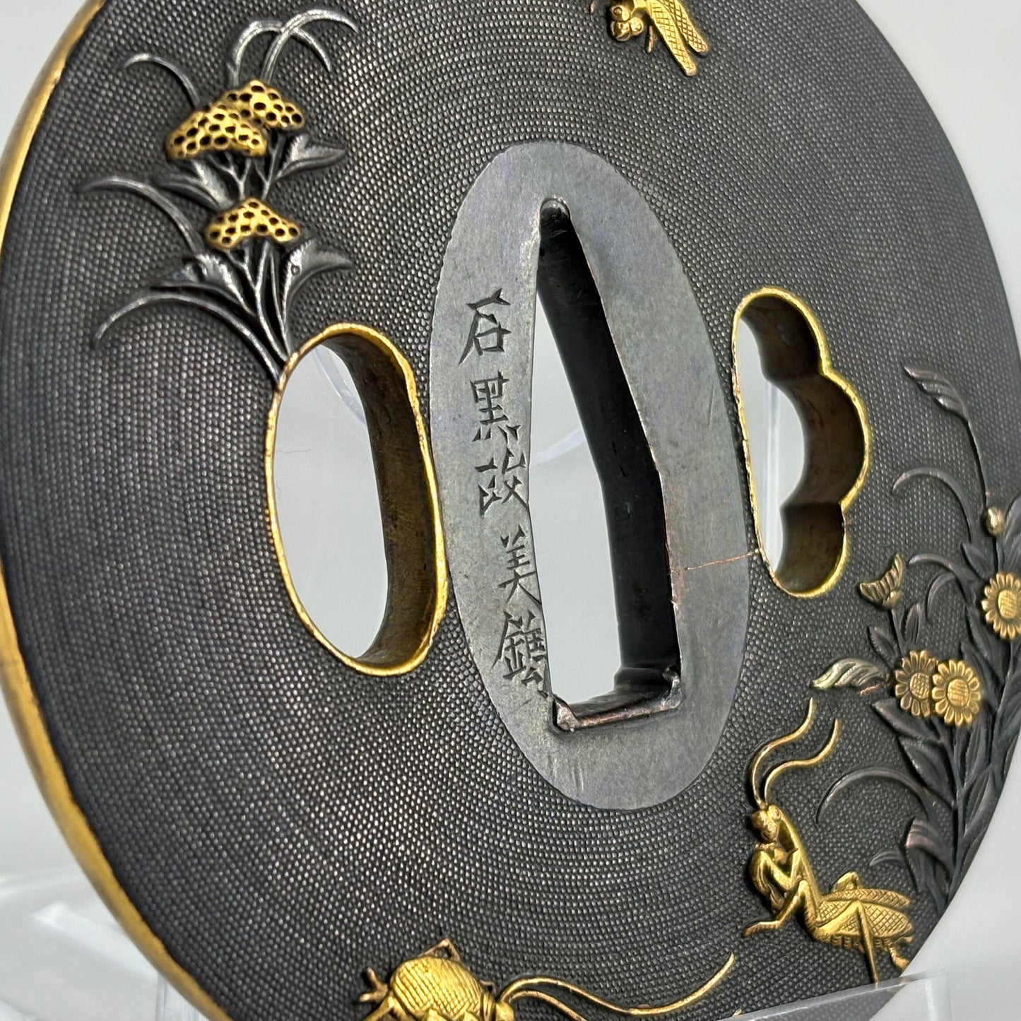 Bird and insect motif sword fittings