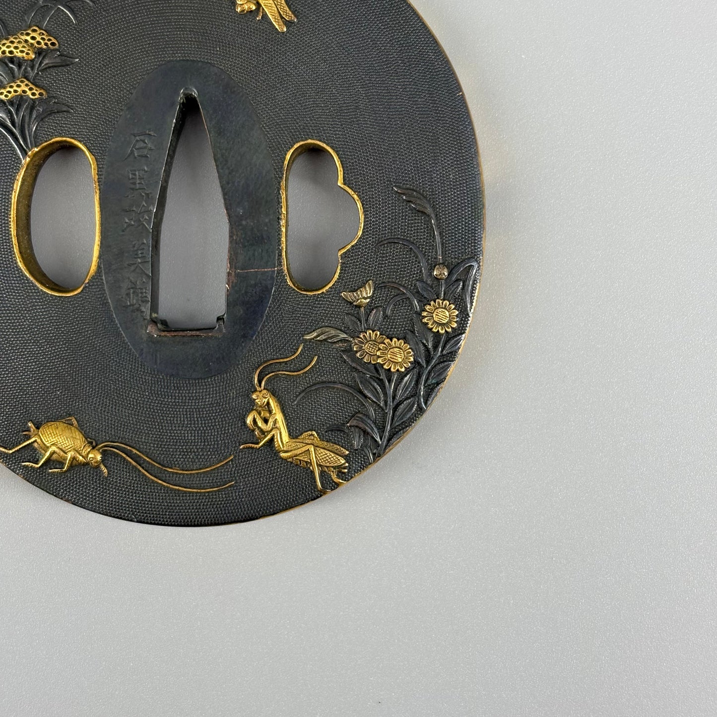Bird and insect motif sword fittings