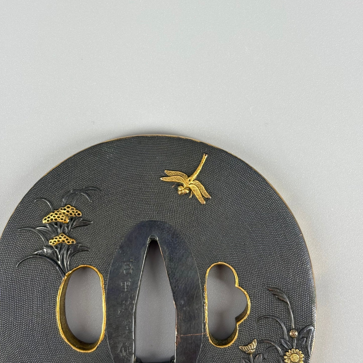 Bird and insect motif sword fittings