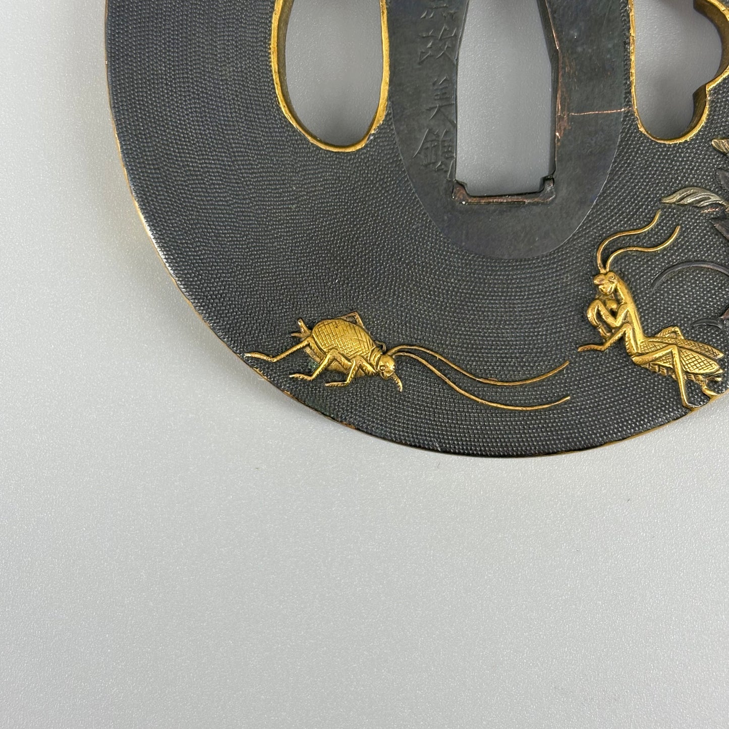 Bird and insect motif sword fittings