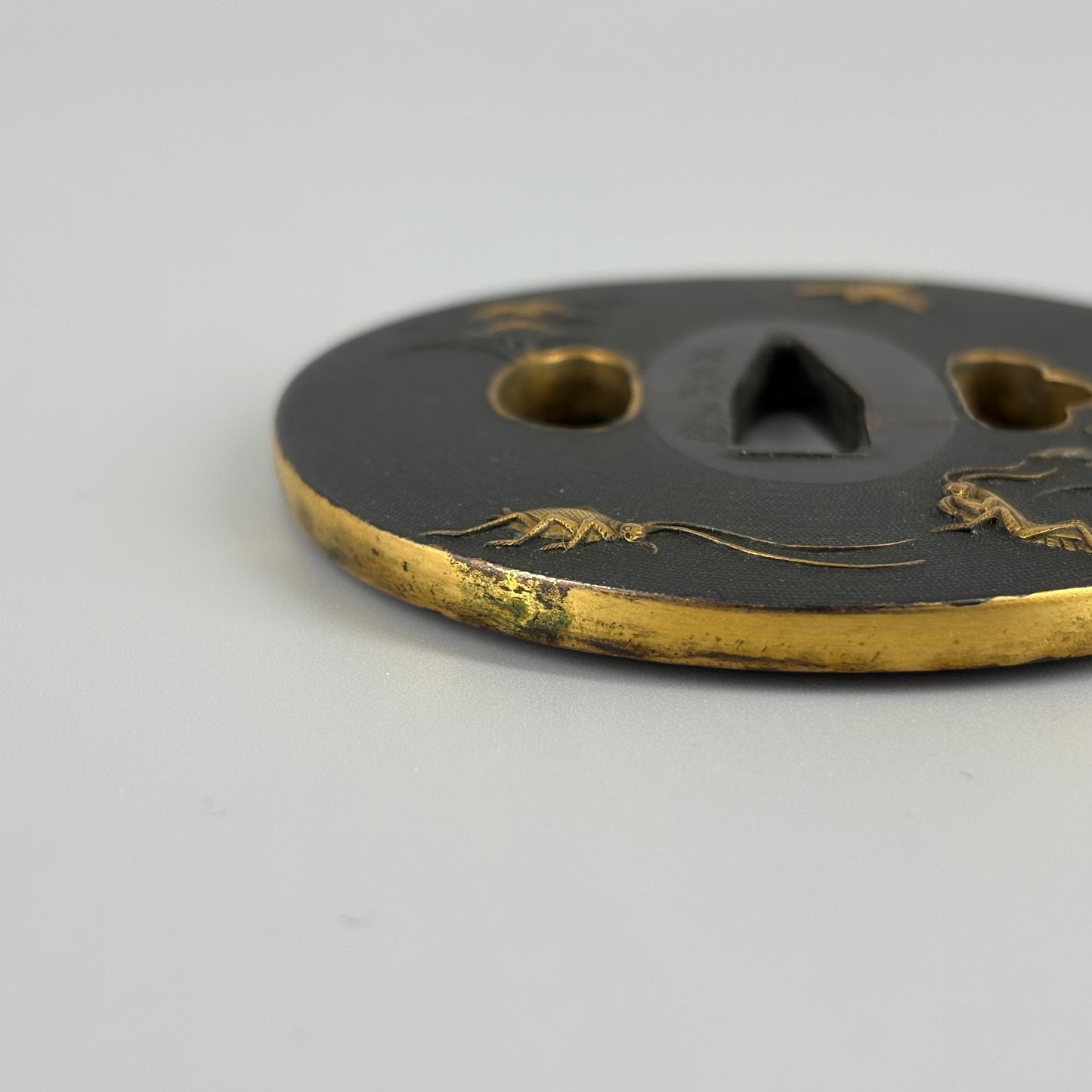 Bird and insect motif sword fittings
