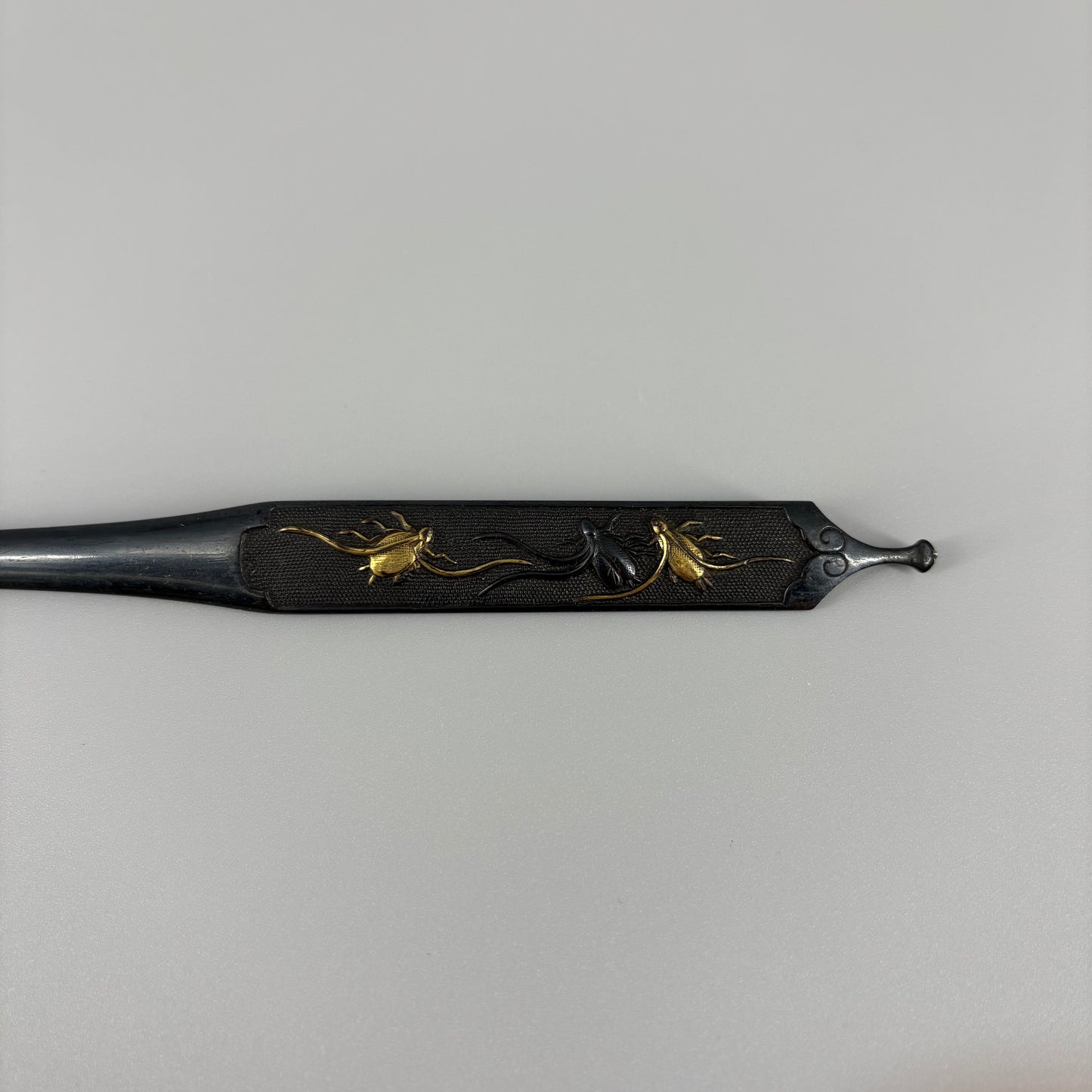 Bird and insect motif sword fittings