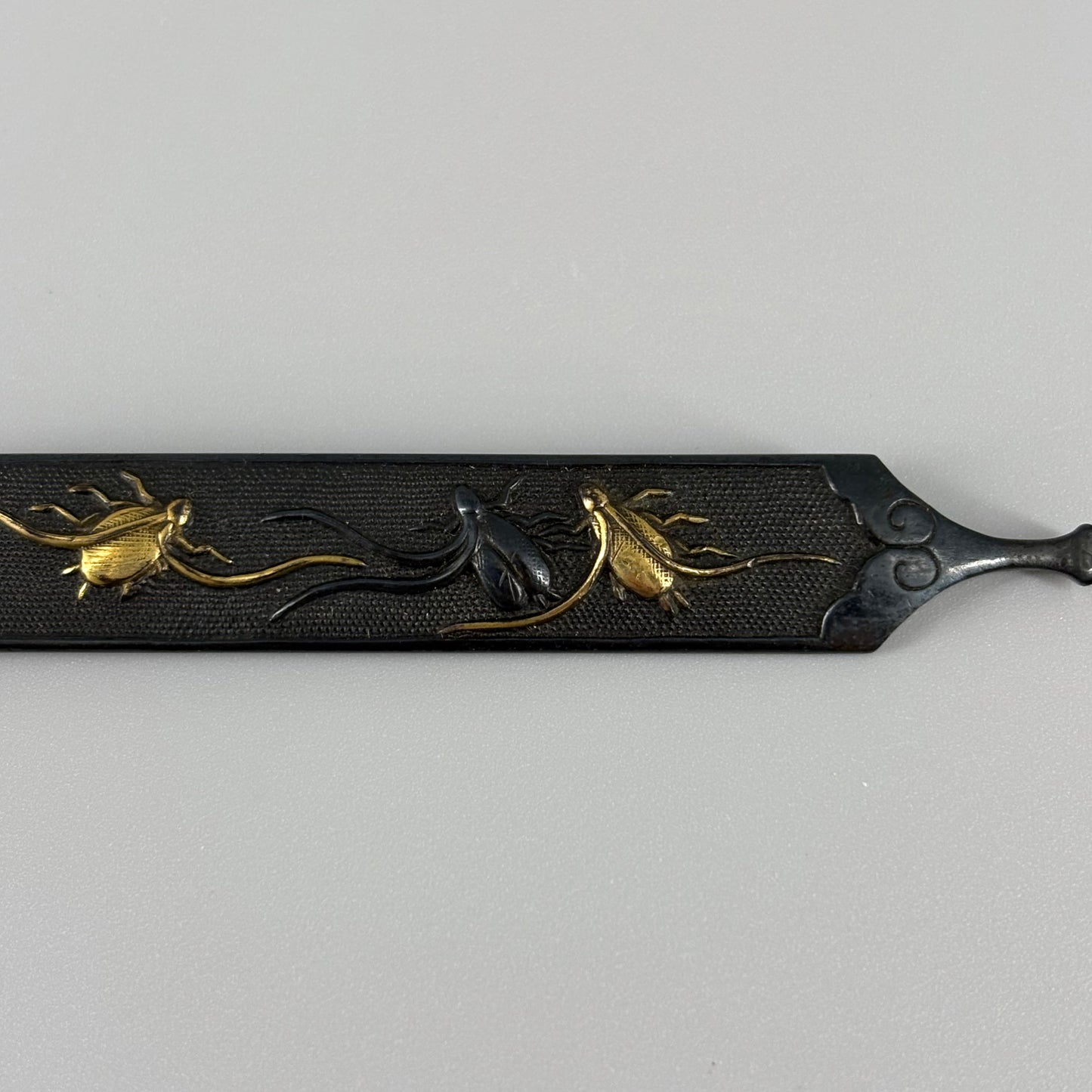 Bird and insect motif sword fittings