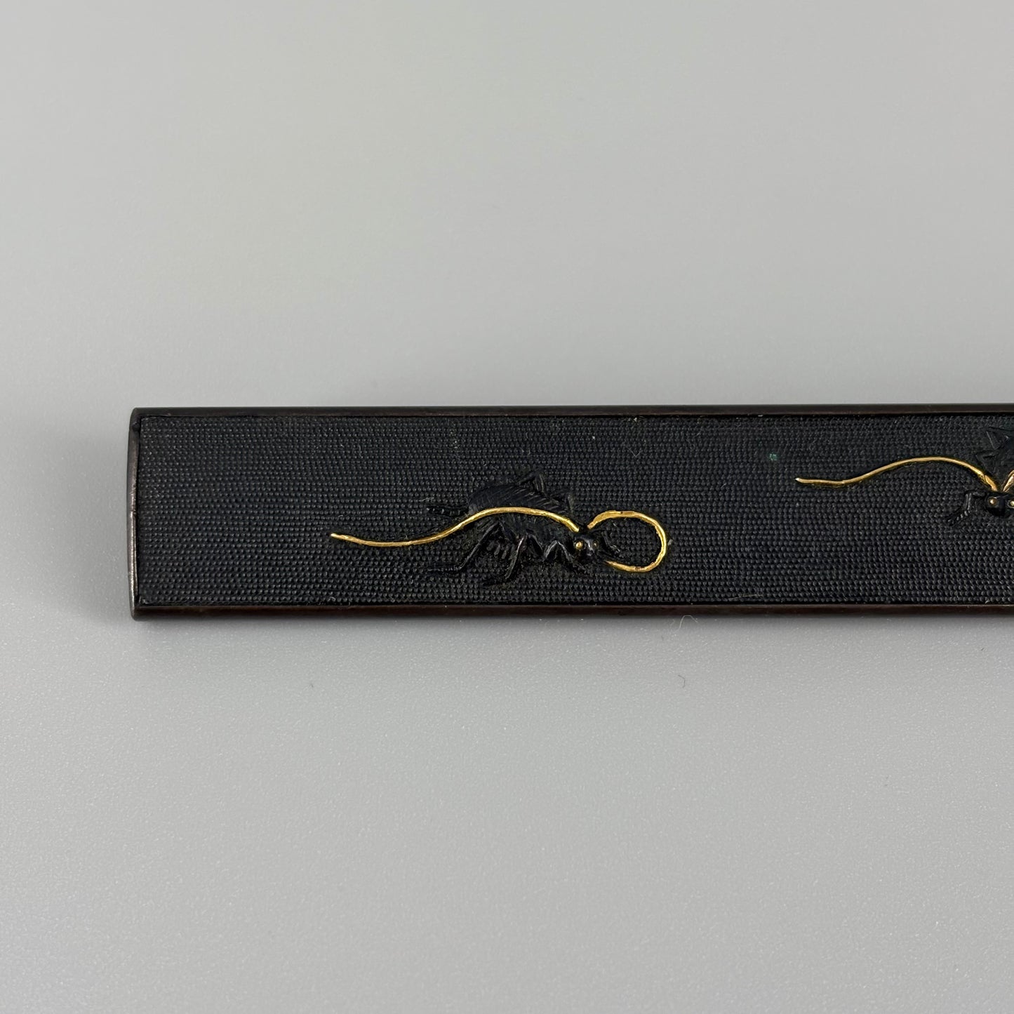Bird and insect motif sword fittings