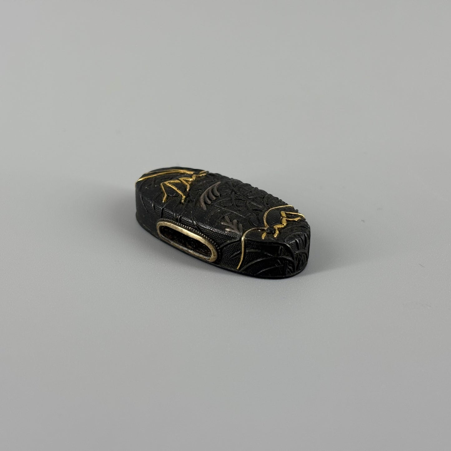 Bird and insect motif sword fittings