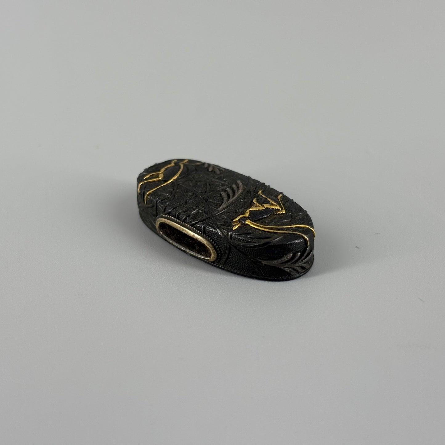 Bird and insect motif sword fittings