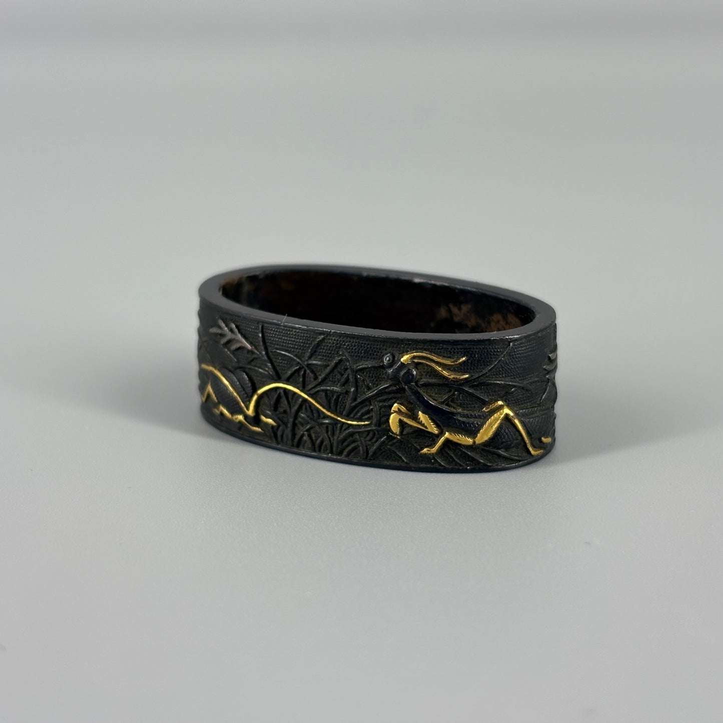 Bird and insect motif sword fittings