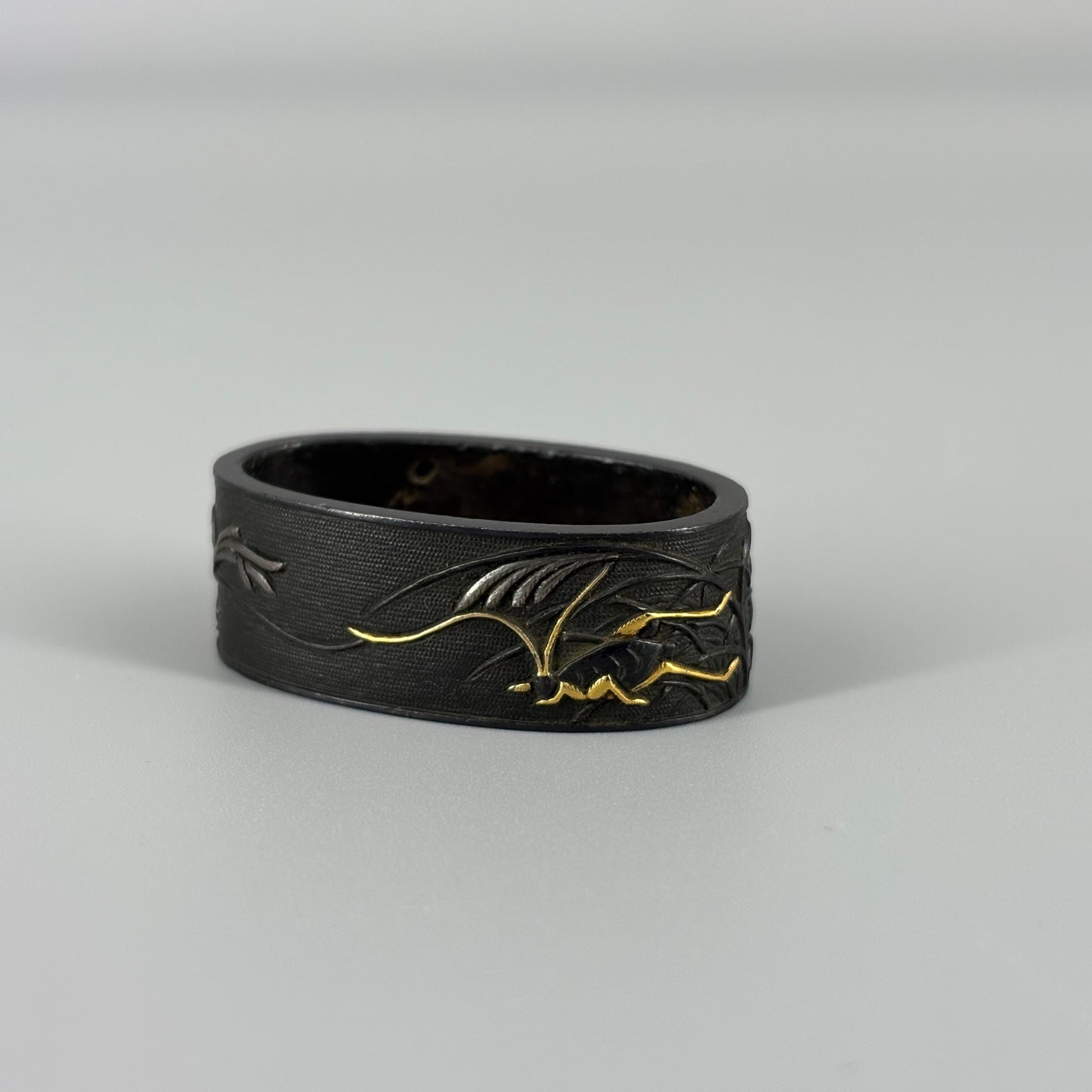 Bird and insect motif sword fittings