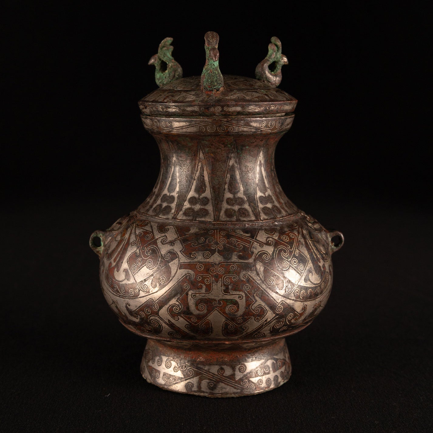 Copper-inlaid silver jar with a beast's face