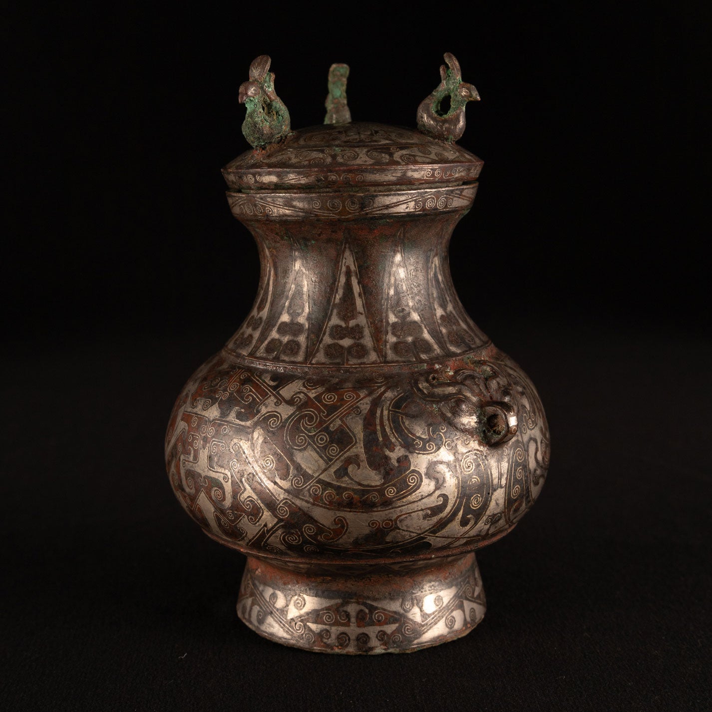 Copper-inlaid silver jar with a beast's face