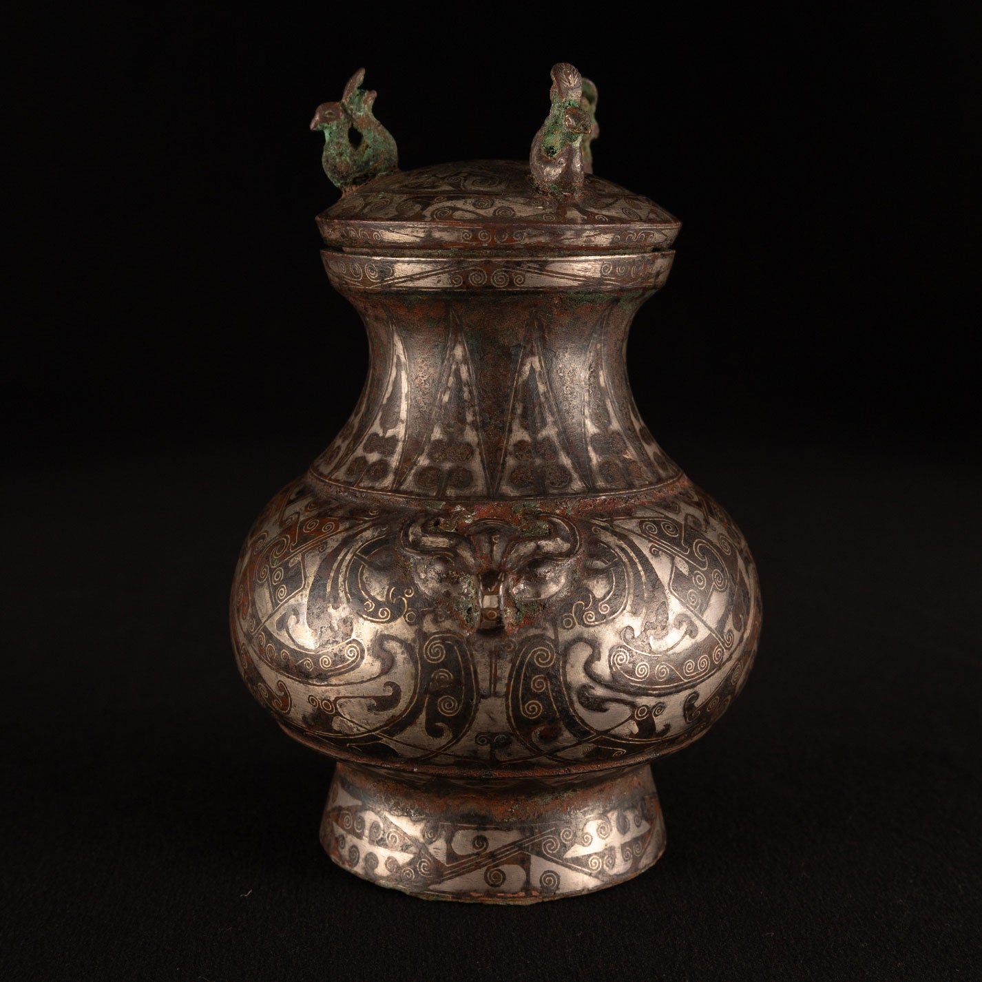 Copper-inlaid silver jar with a beast's face