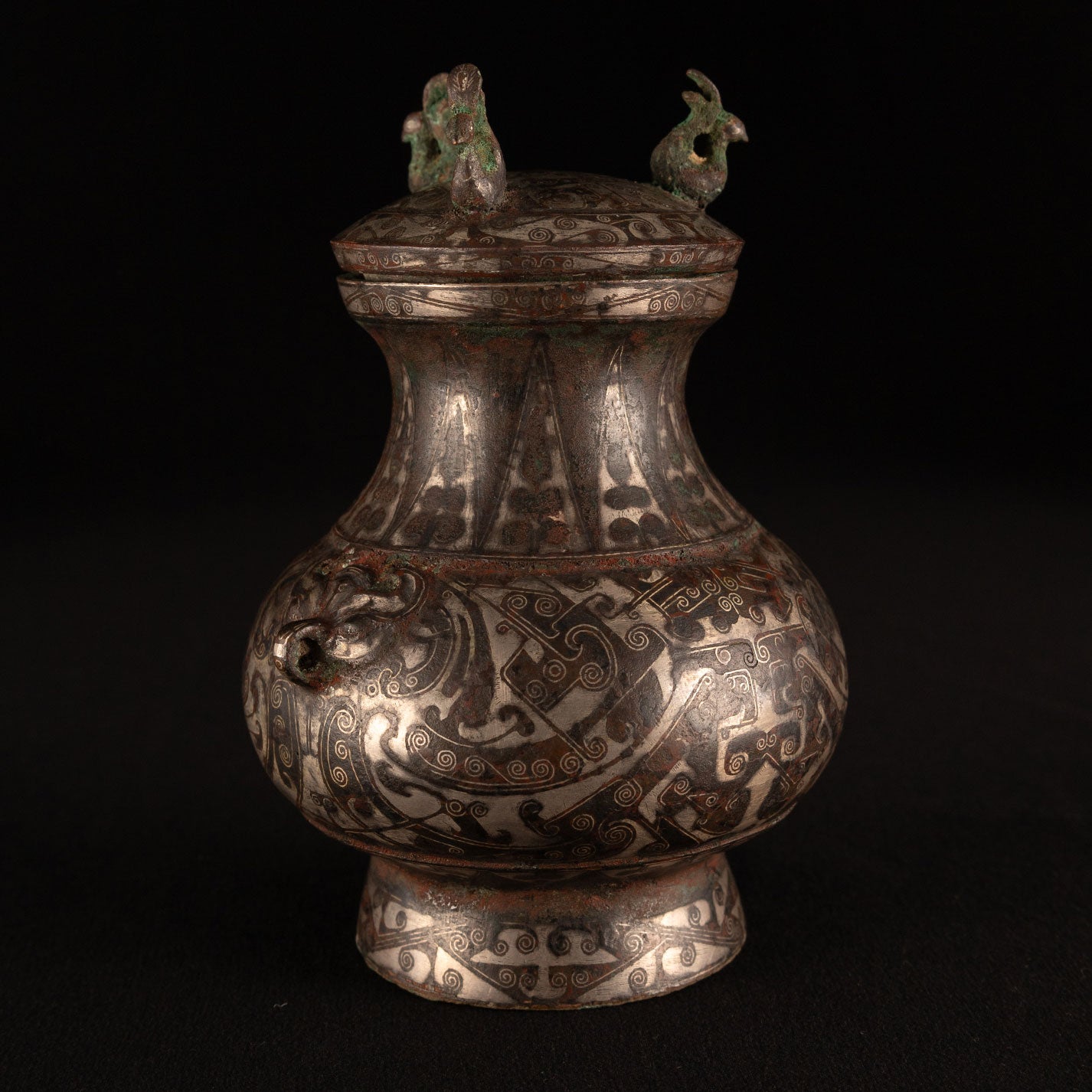 Copper-inlaid silver jar with a beast's face