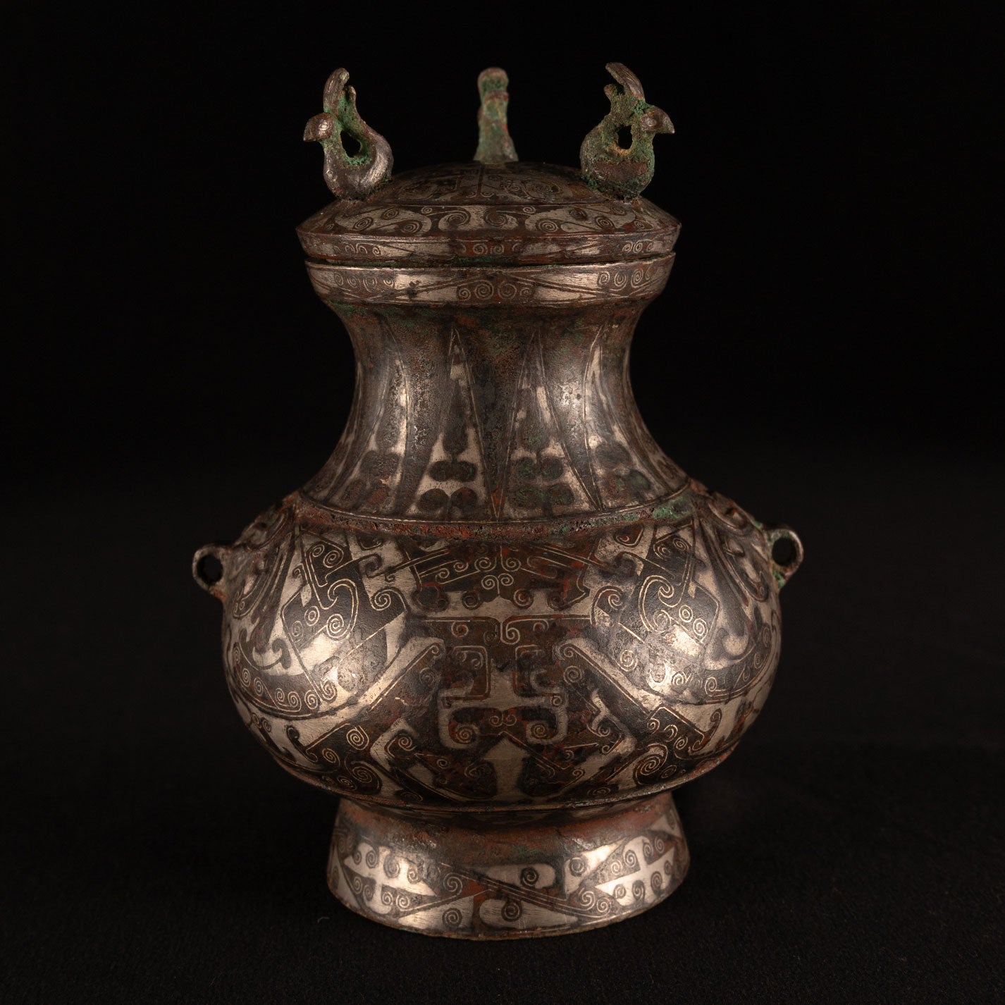 Copper-inlaid silver jar with a beast's face