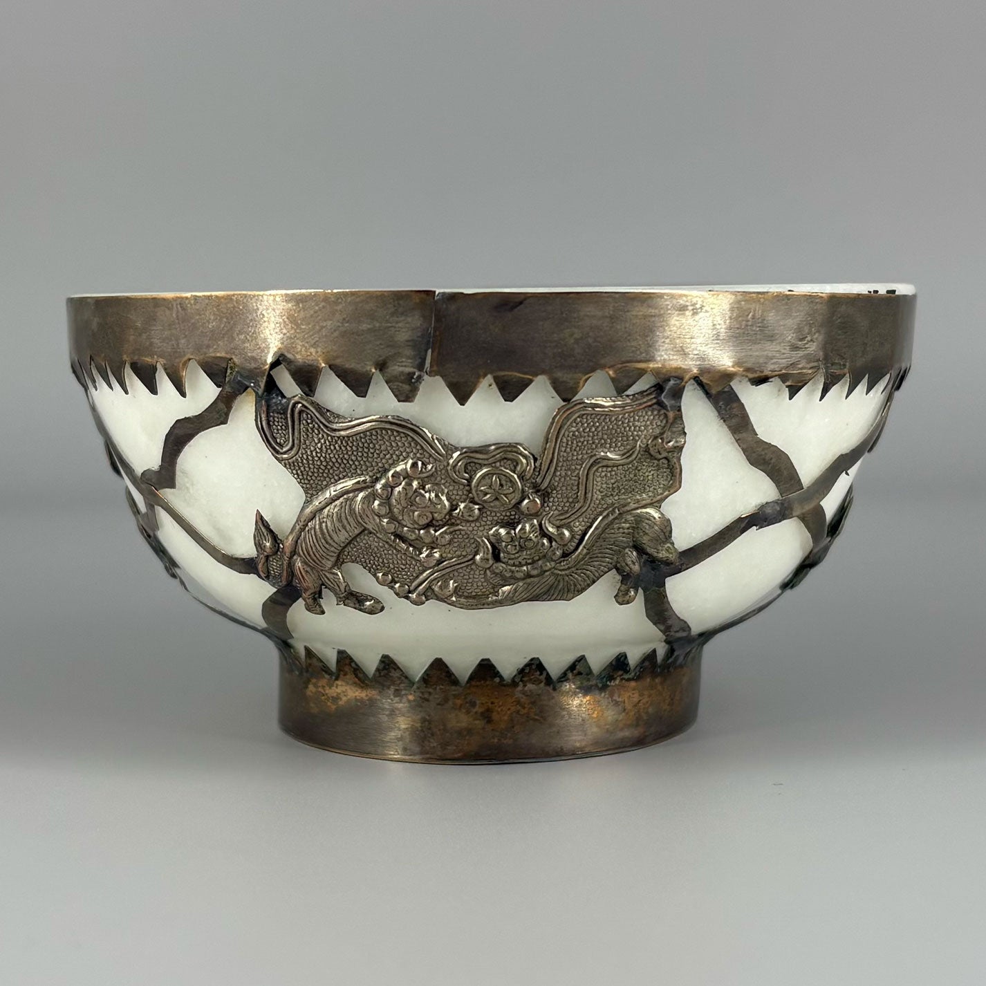 White jade bowl with brass decoration