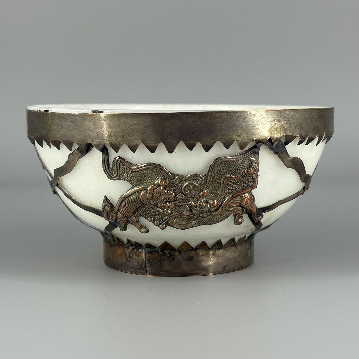 White jade bowl with brass decoration