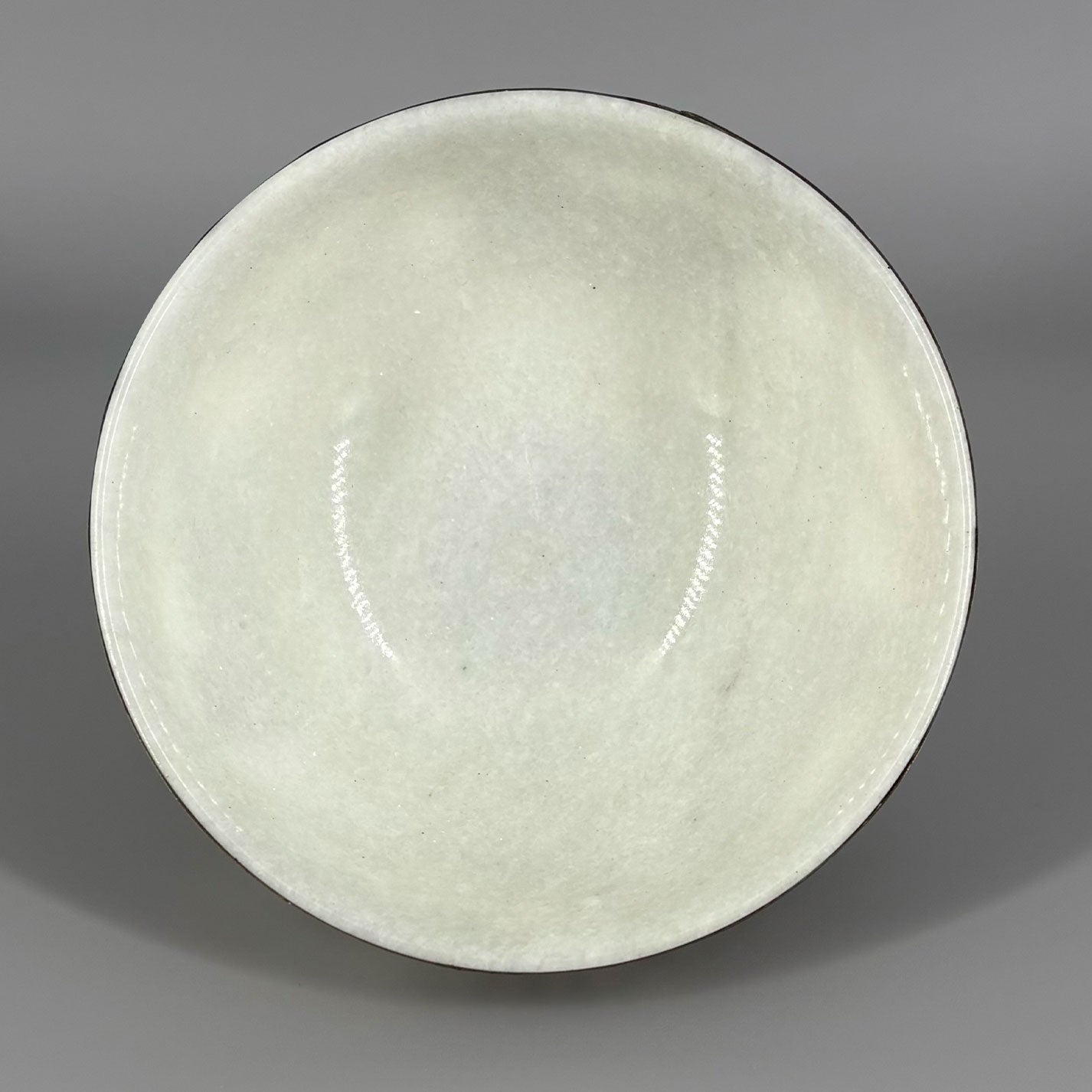 White jade bowl with brass decoration