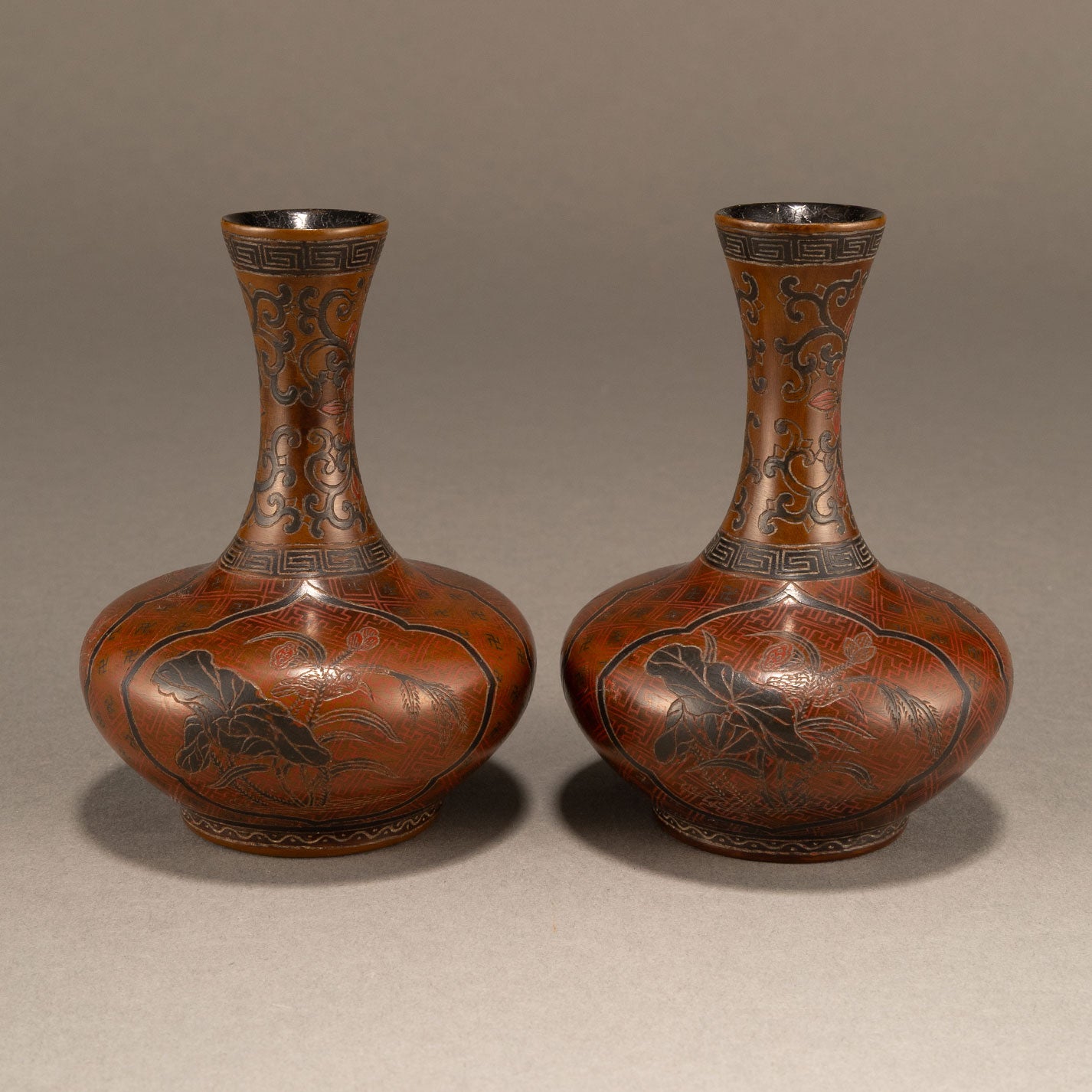 A pair of lacquer bottles