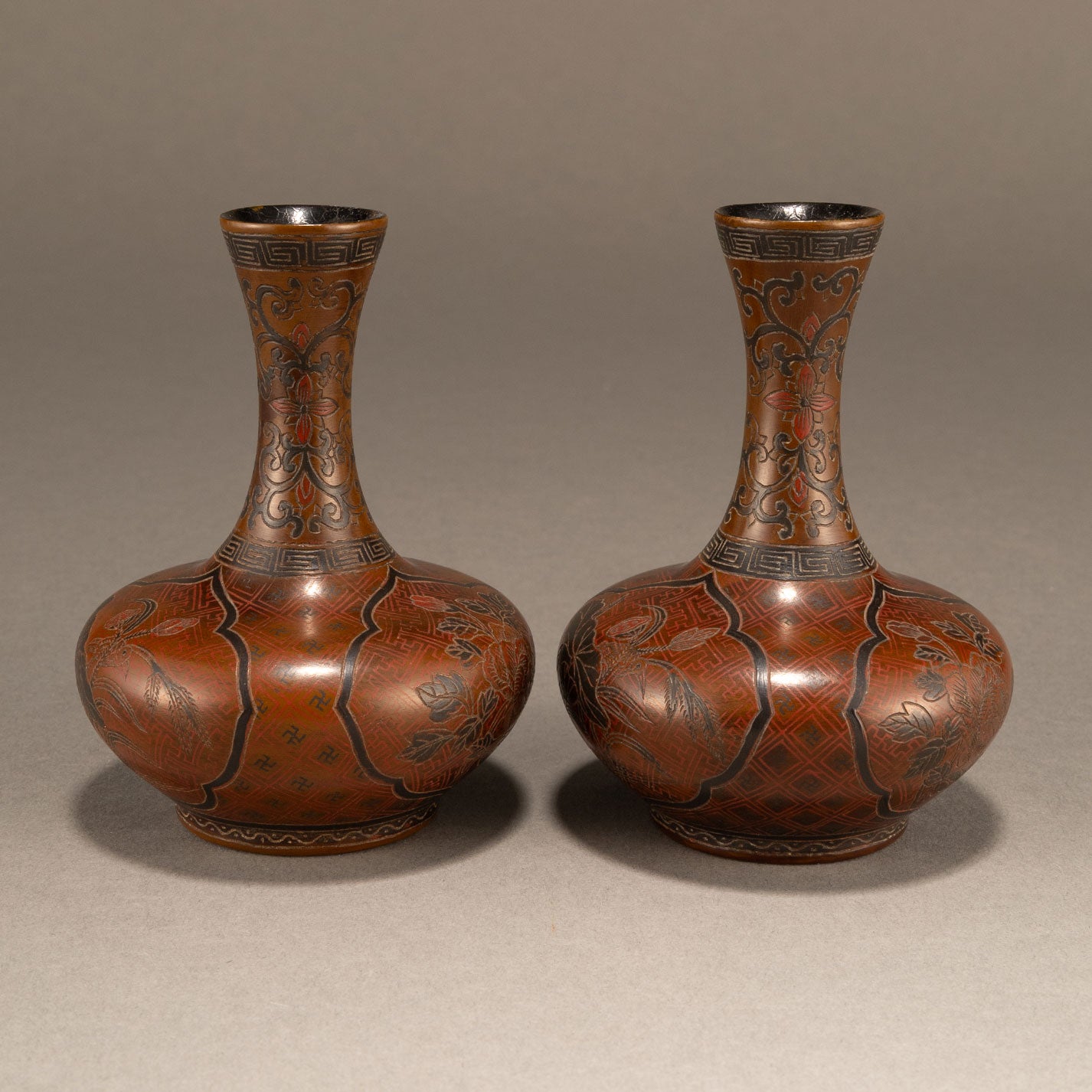 A pair of lacquer bottles