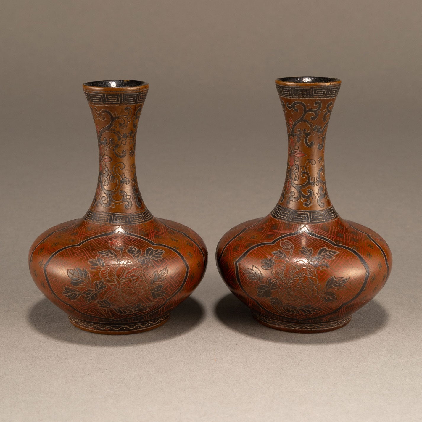 A pair of lacquer bottles