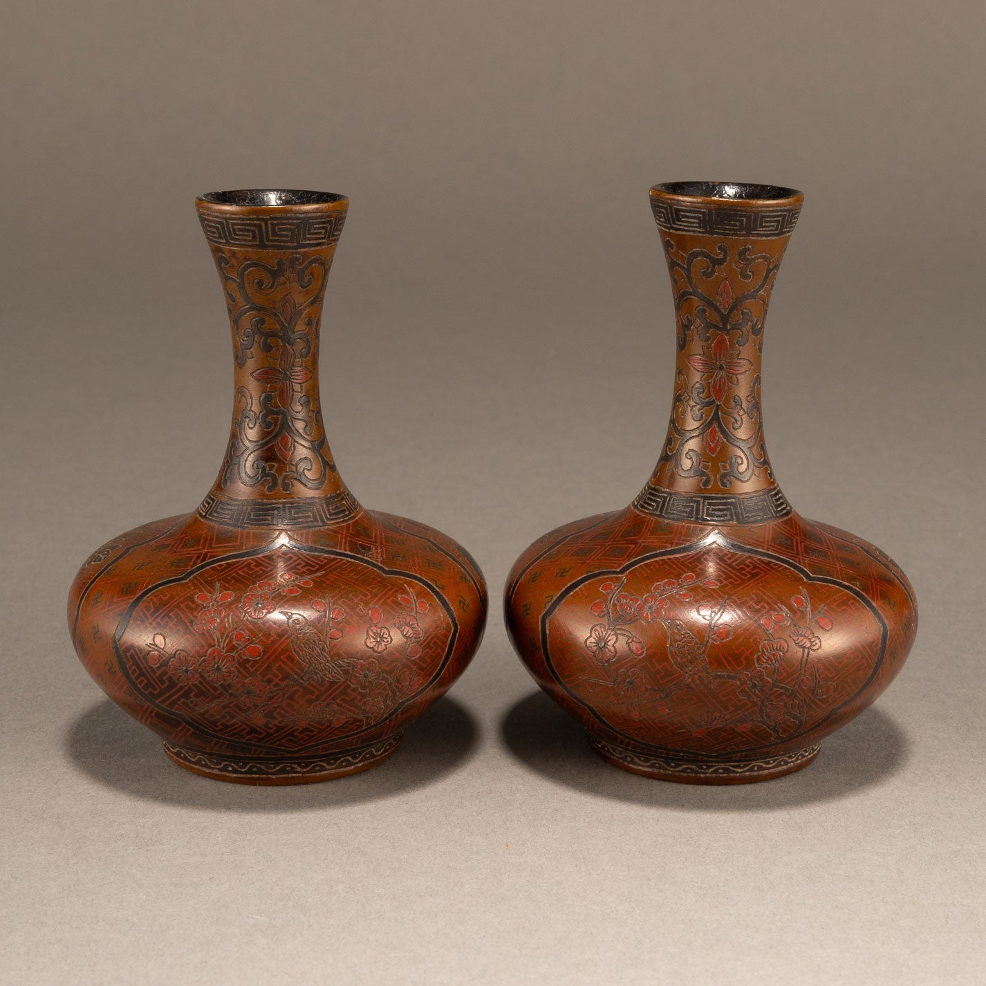 A pair of lacquer bottles