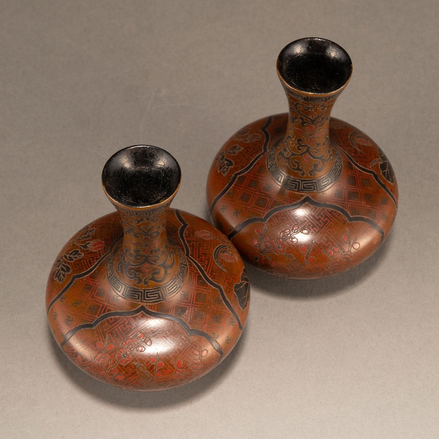 A pair of lacquer bottles