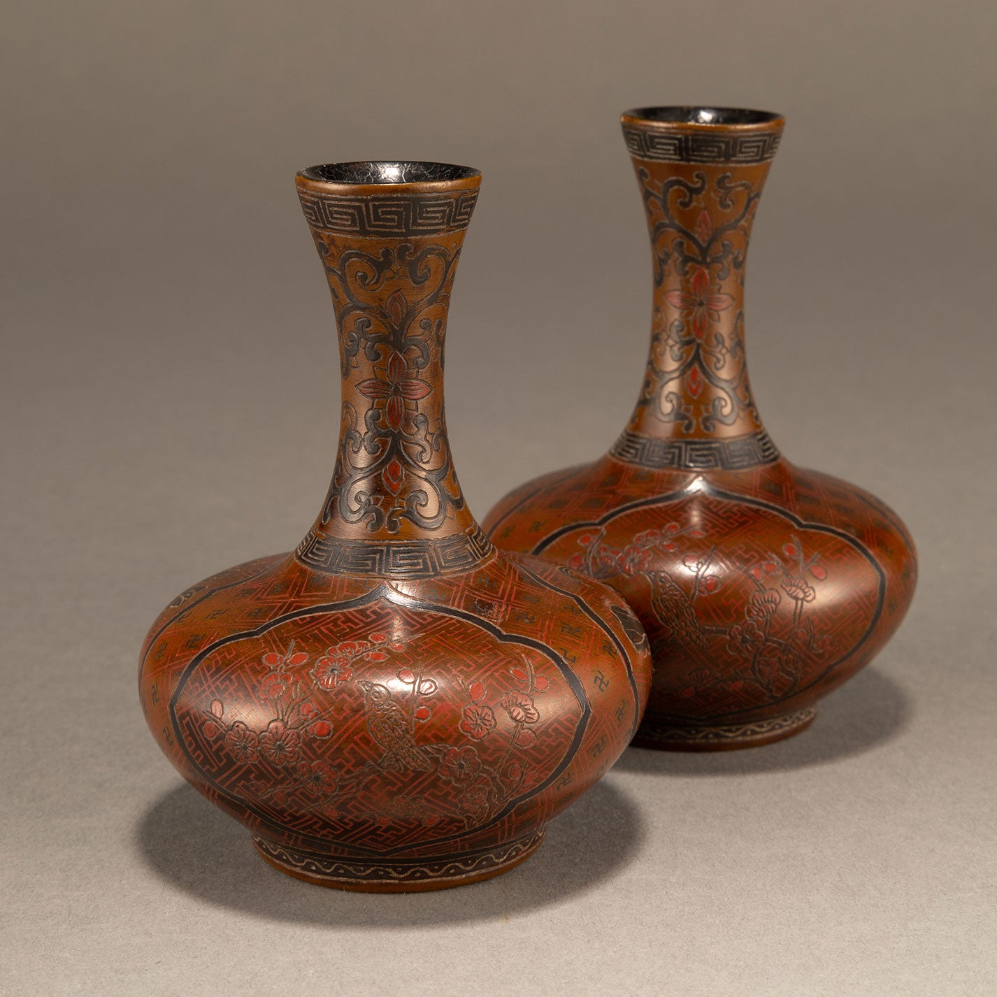 A pair of lacquer bottles