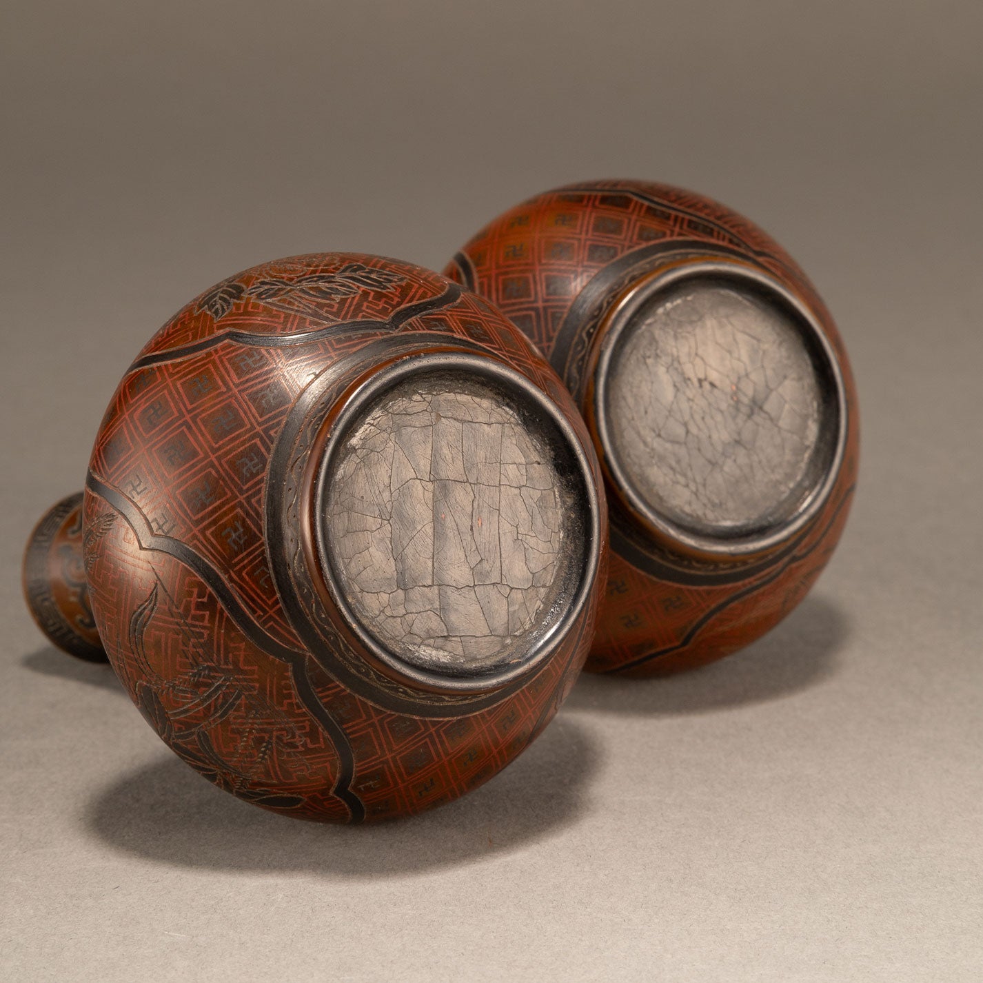 A pair of lacquer bottles
