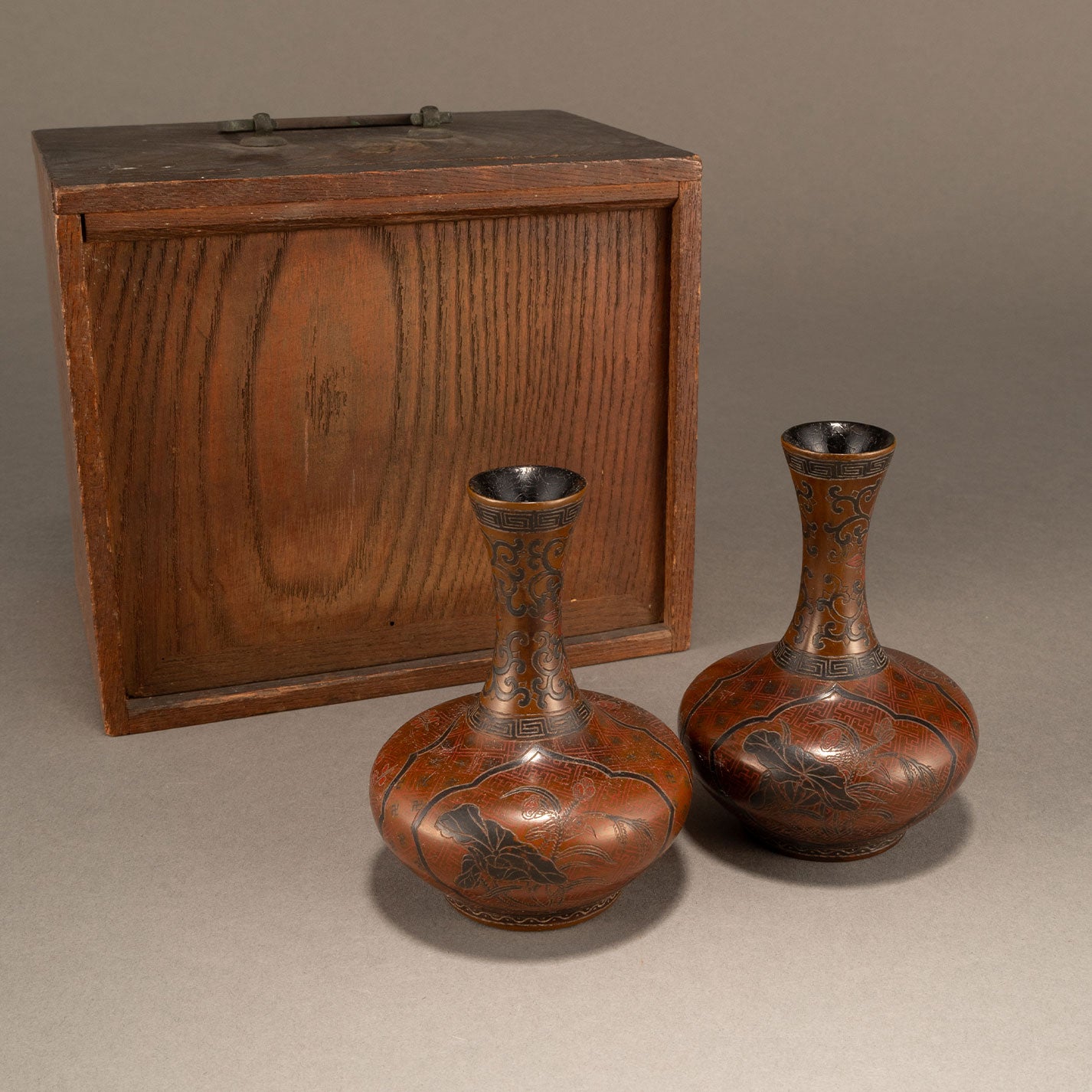 A pair of lacquer bottles