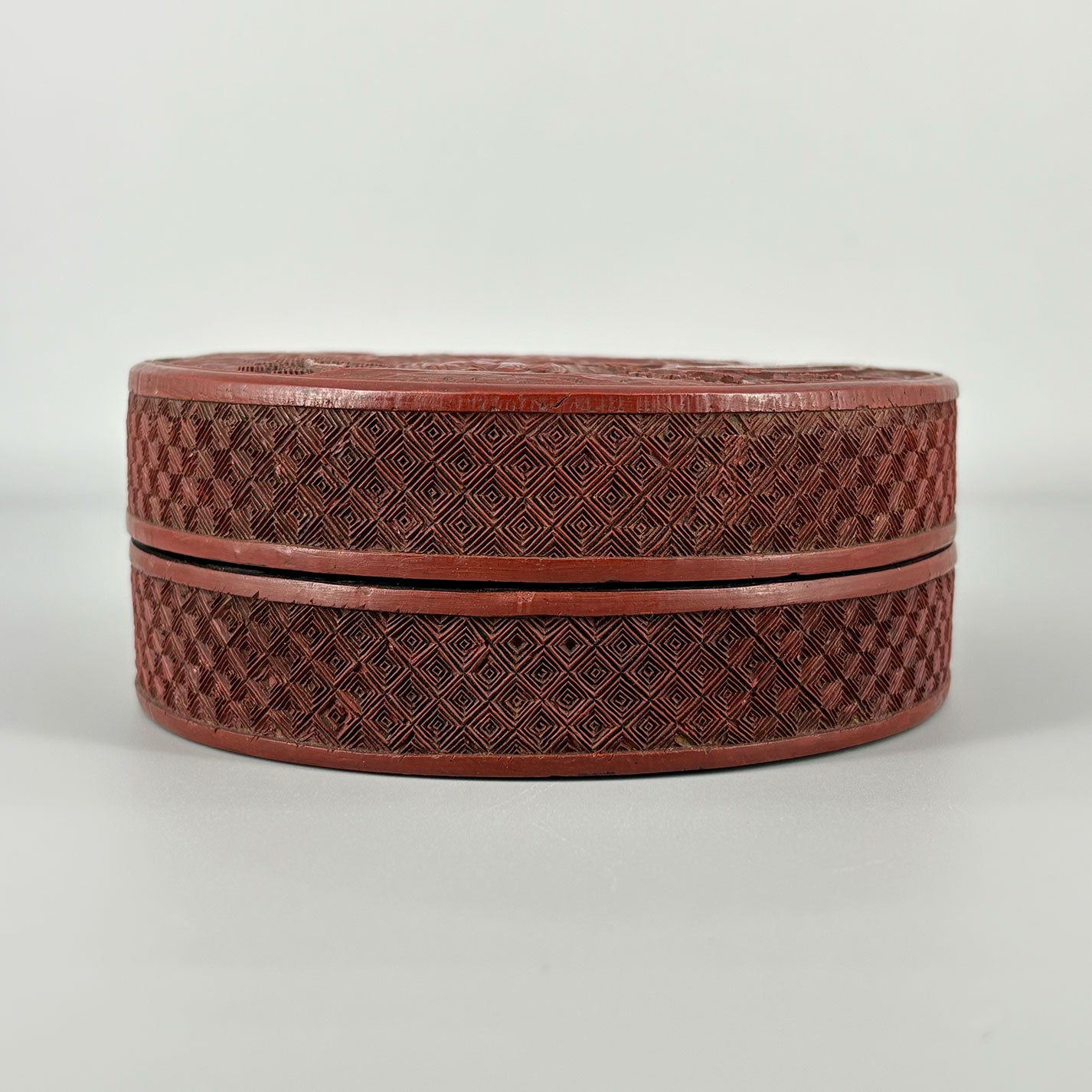 Carved Red Lacquer Box with Figure Design