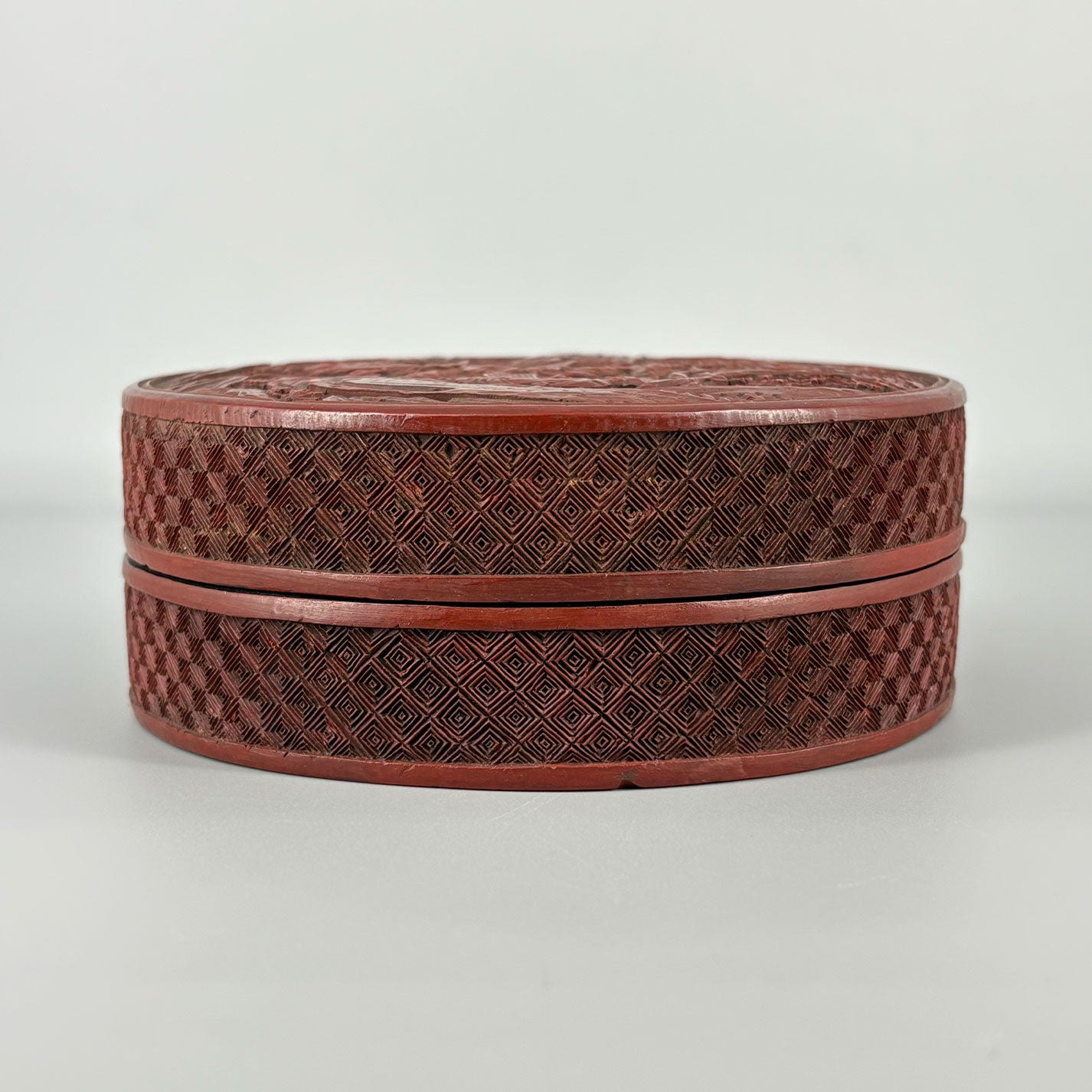 Carved Red Lacquer Box with Figure Design
