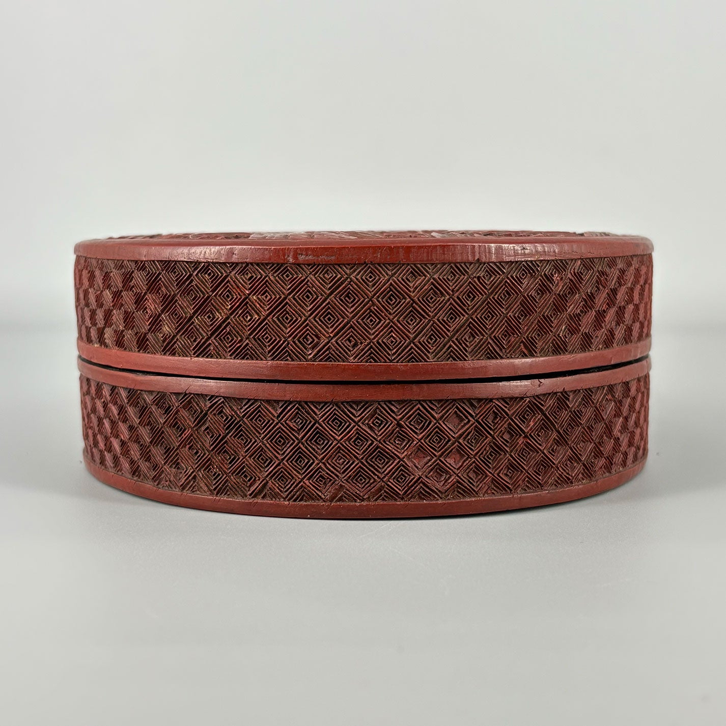 Carved Red Lacquer Box with Figure Design