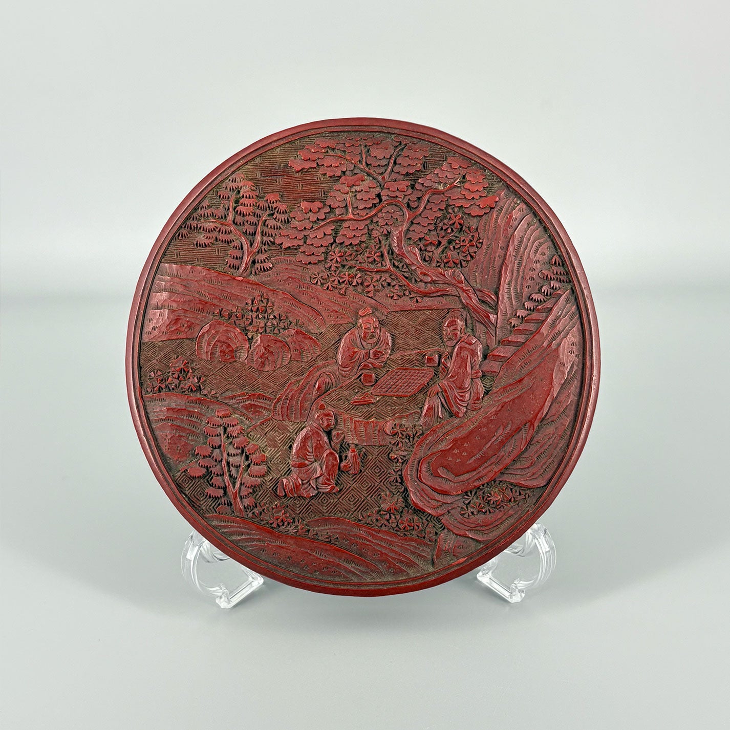 Carved Red Lacquer Box with Figure Design