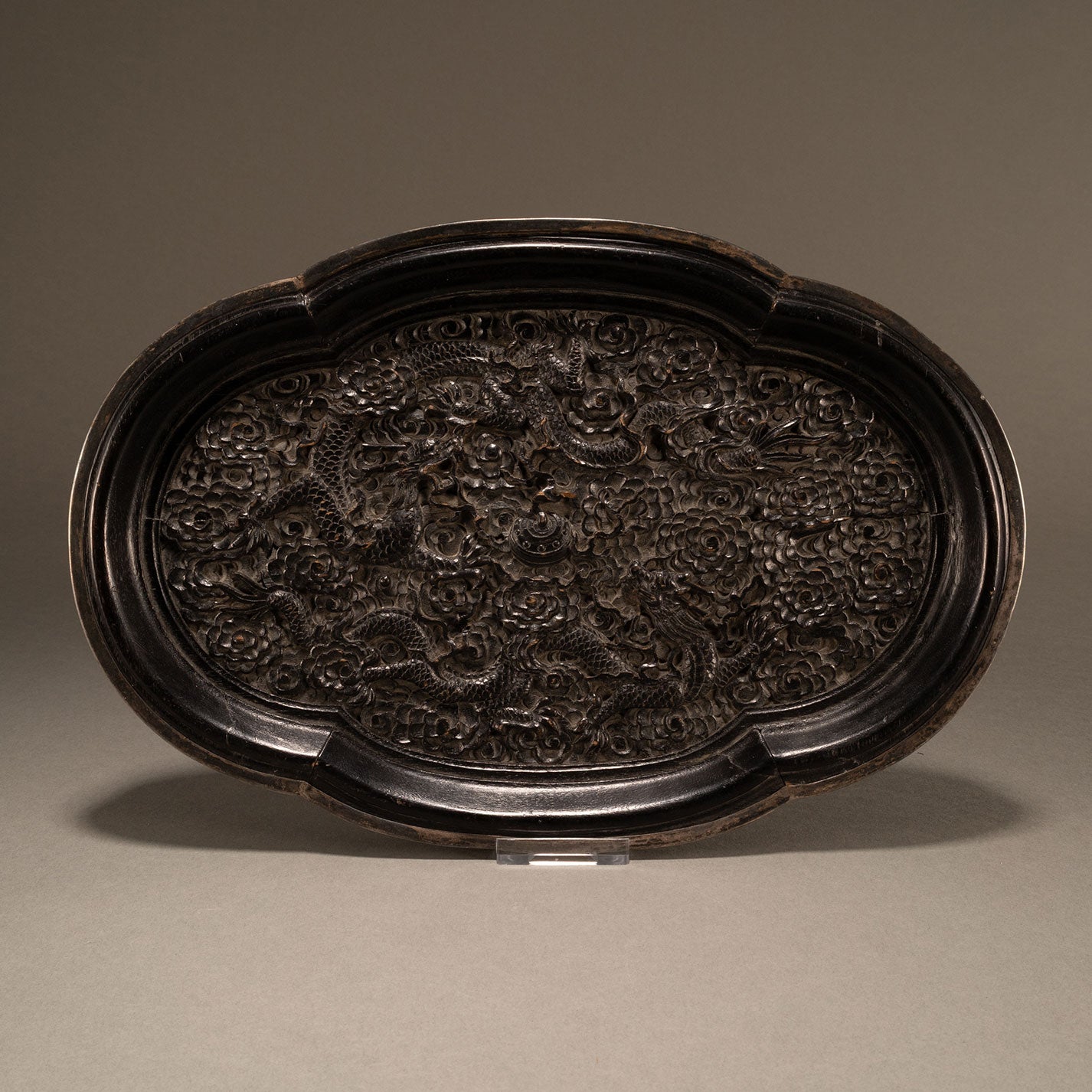 Carved wooden plate with double dragons and begonia motif