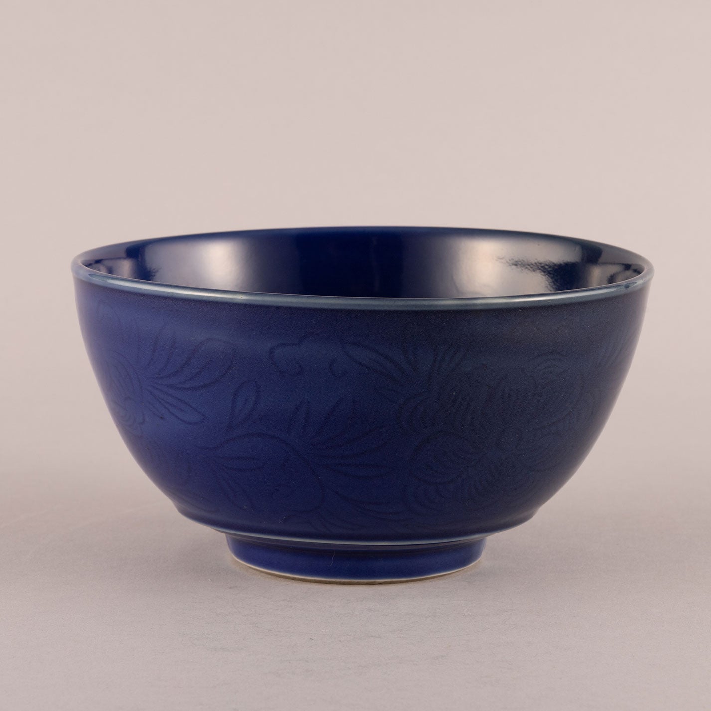 Blue glaze bowl with engraved floral motif