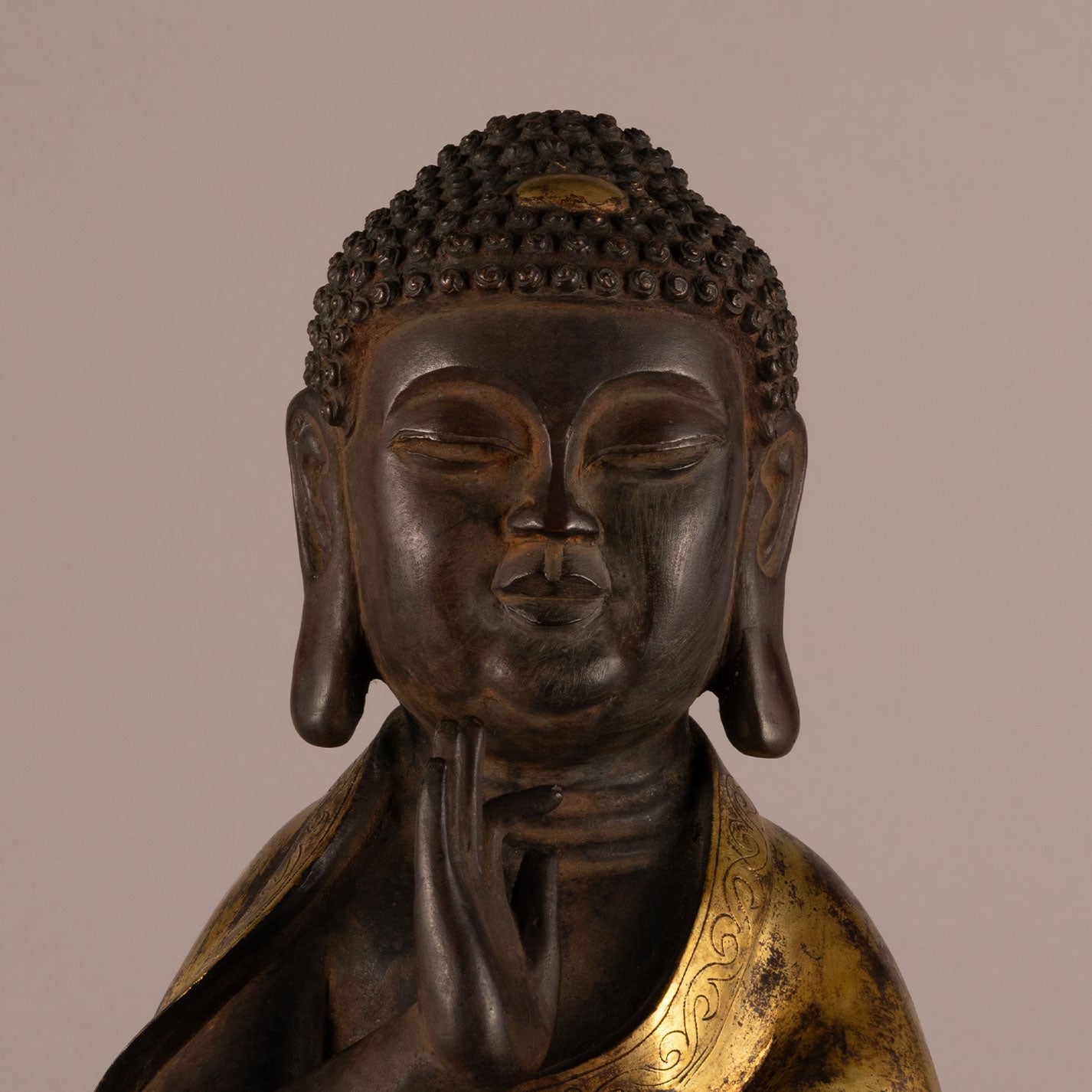 Bronze and gold standing Buddha statue