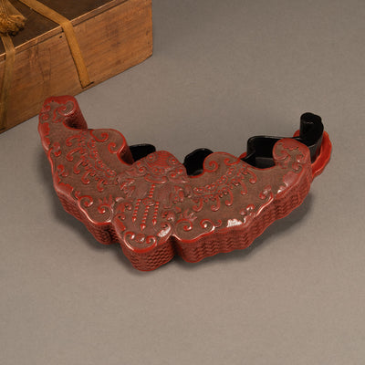 Red bat-shaped lid box