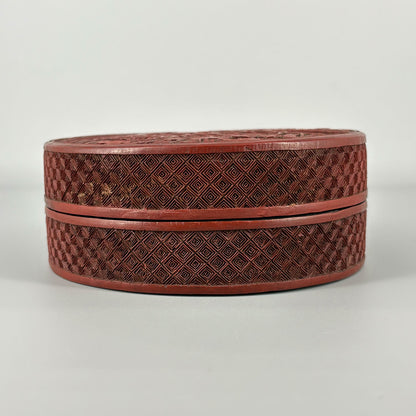 Carved Red Lacquer Box with Figure Design