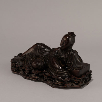 Rosewood Statue of a Reclining Tennyo