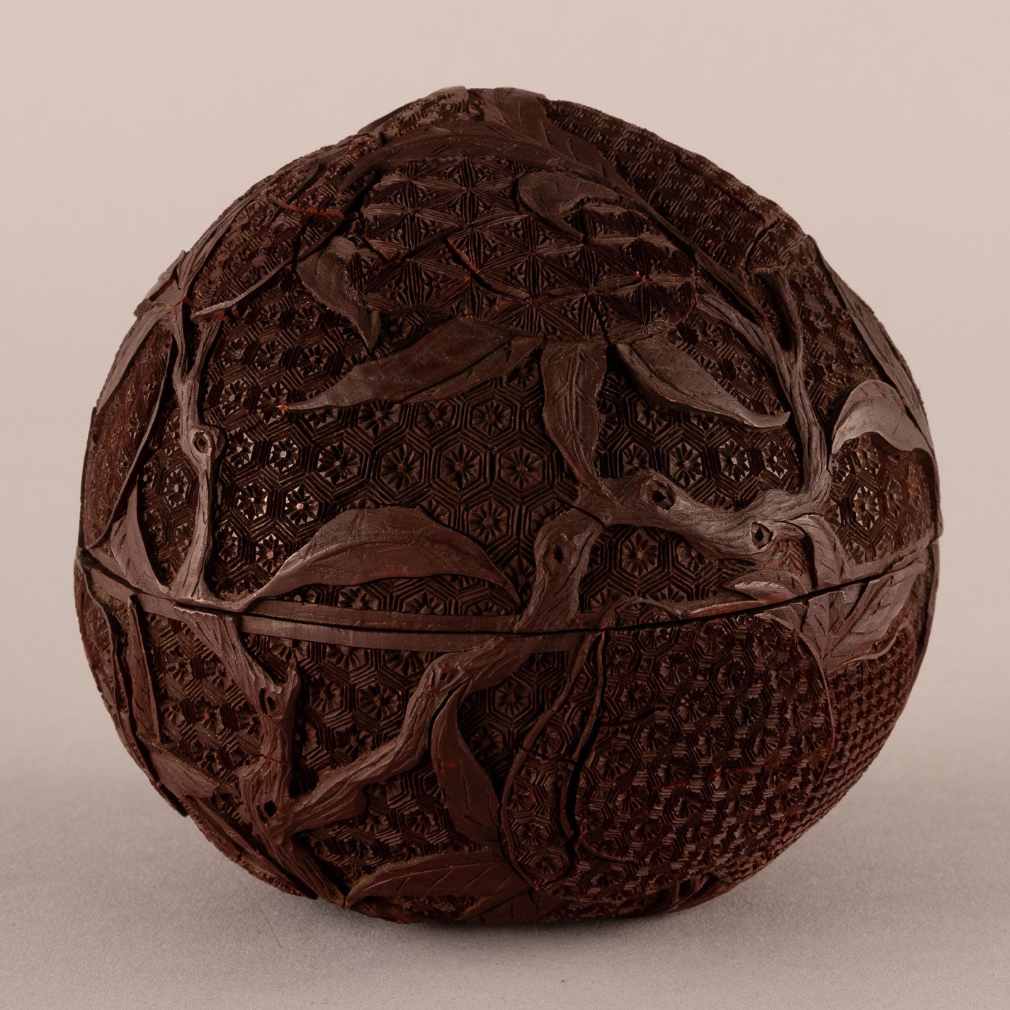 Carved red peach-shaped box with lid