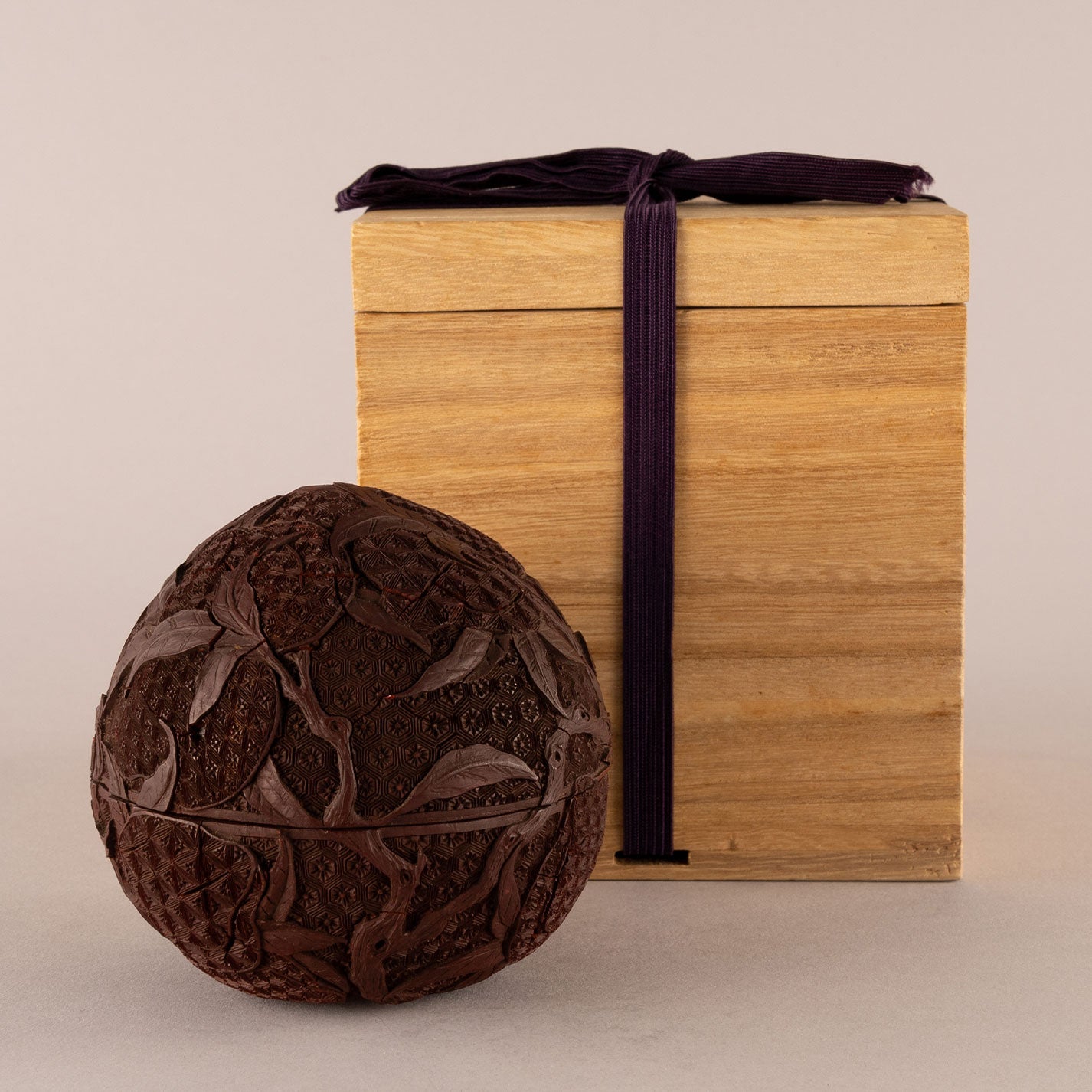 Carved red peach-shaped box with lid